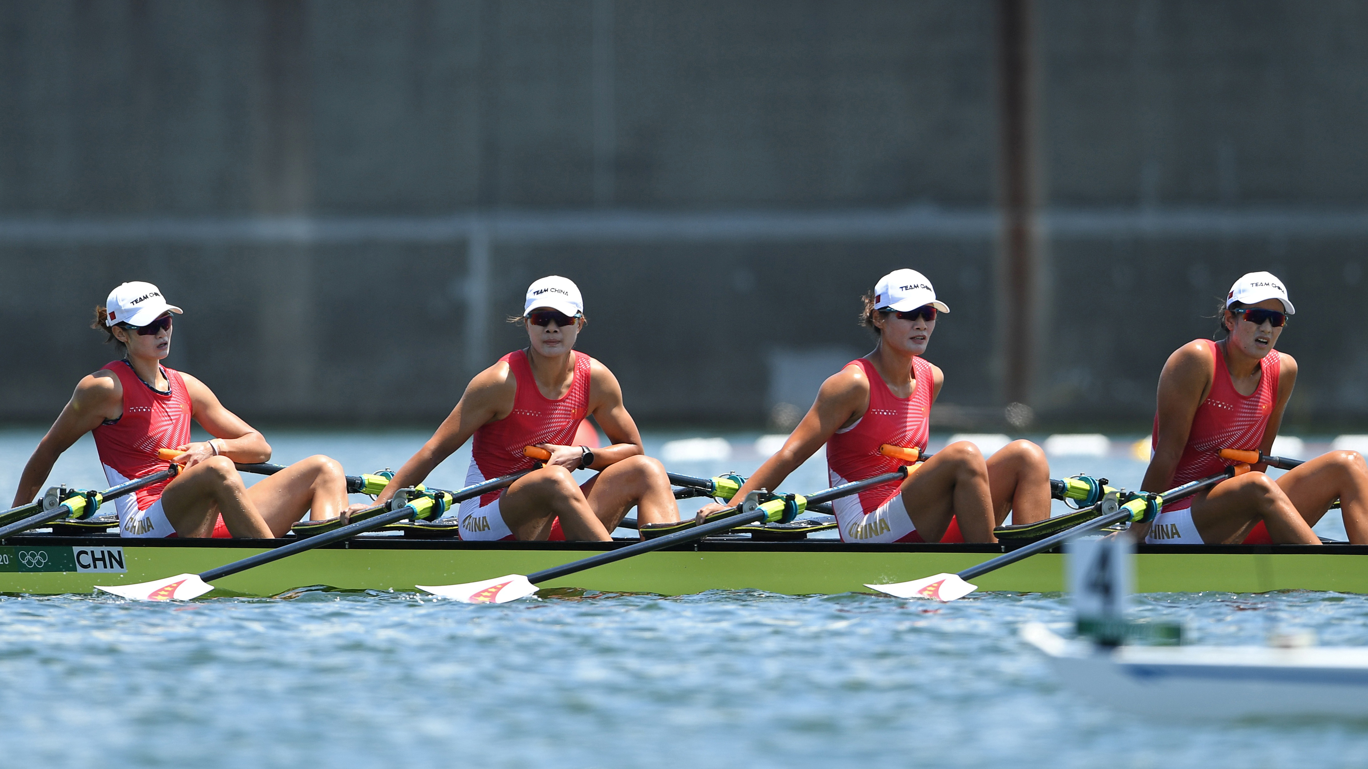 Tokyo 2020 Olympics Chinese rowing team members Chen Yunxia, Zhang Ling, Lyu Yang and Cui Xiaotong react after competing and finishing first in their heat.