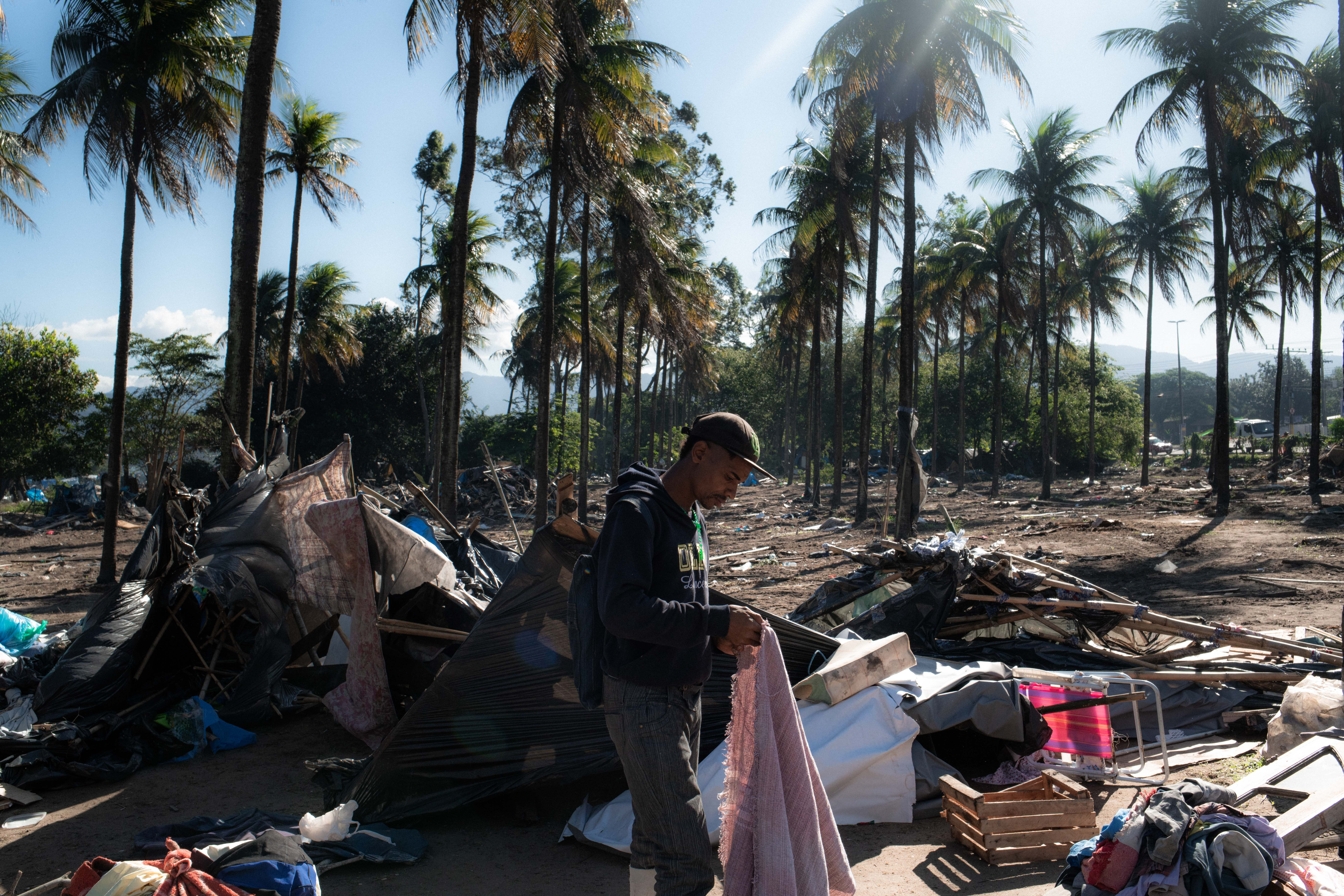 Residents of the 'First of May Refugee Camp' were evicted last week from land that belongs to state oil firm Petrobras and that they had occupied in Itaguai, Rio de Janeiro, Brazil, making a difficult situation worse for thousands who had called the settlement home [Ian Cheibub/Al Jazeera]