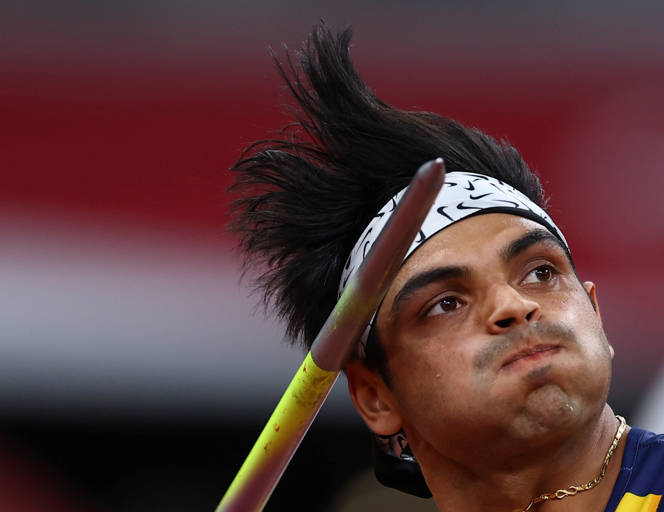 Chopra of India, 23, claimed men's javelin gold with an 87.58-metre throw at the Olympic Stadium [Kai Pfaffenbach/Reuters]