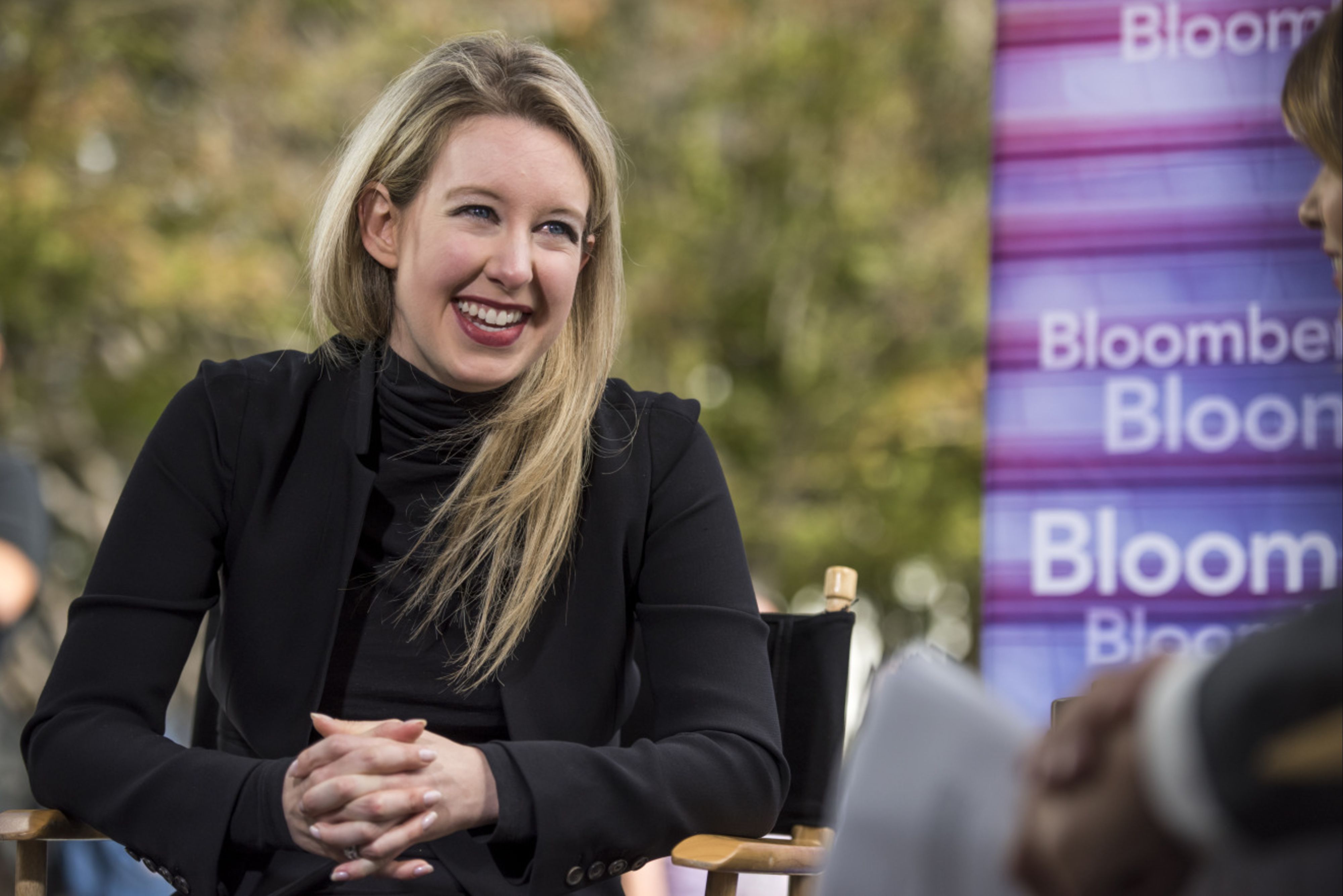 In her heyday, the turtleneck-wearing, raspy-voiced Elizabeth Holmes was hailed as a disruptive genius and investor darling who claimed to have a machine called the Edison that used a tiny drop of blood to screen for a variety of medical conditions [File: David Paul Morris/Bloomberg]