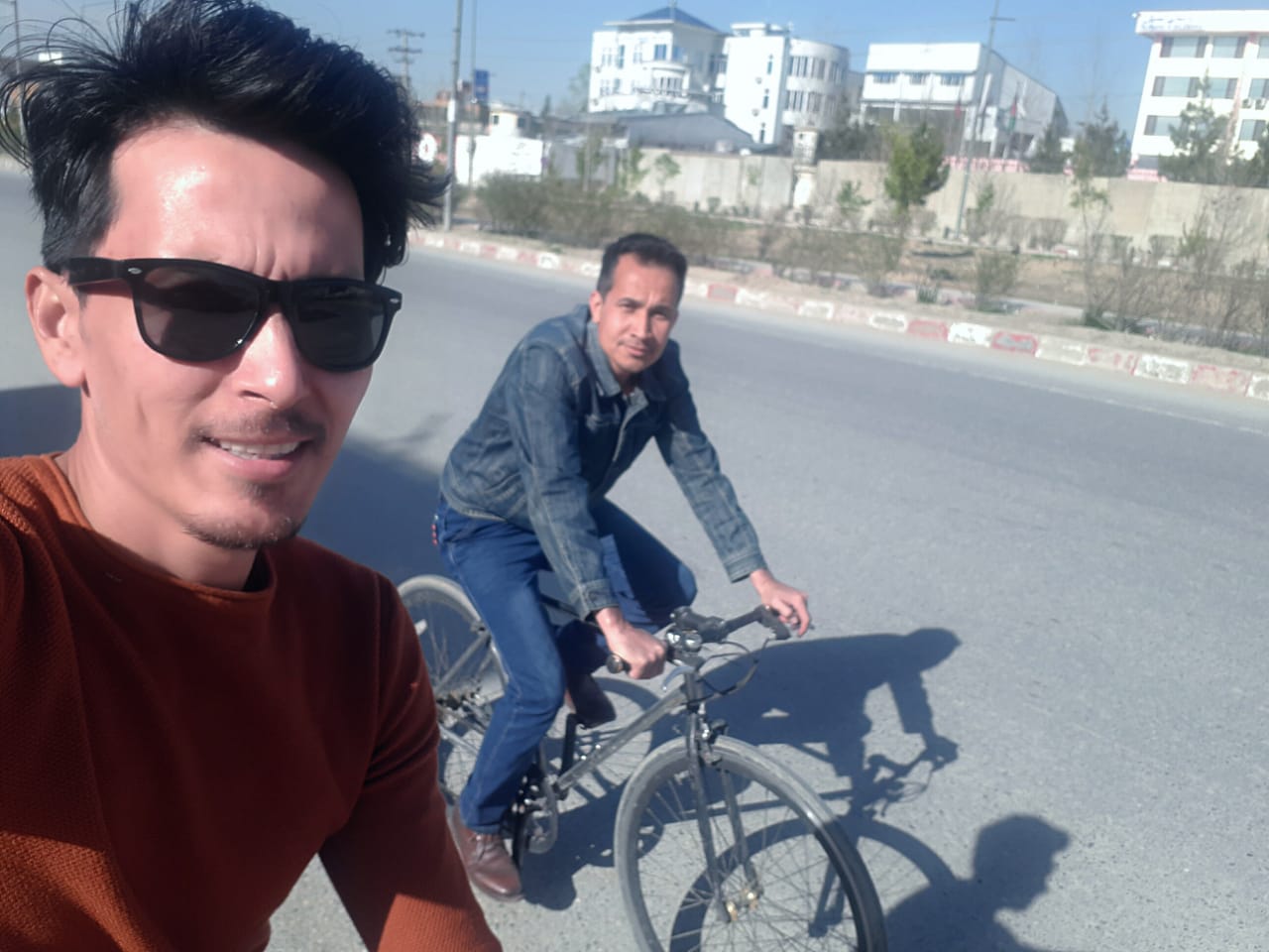 Alireza Ahmadi, right, and Zakarya Hassani cycling in Kabul in 2020 [Photo courtesy of Zakarya Hassani]