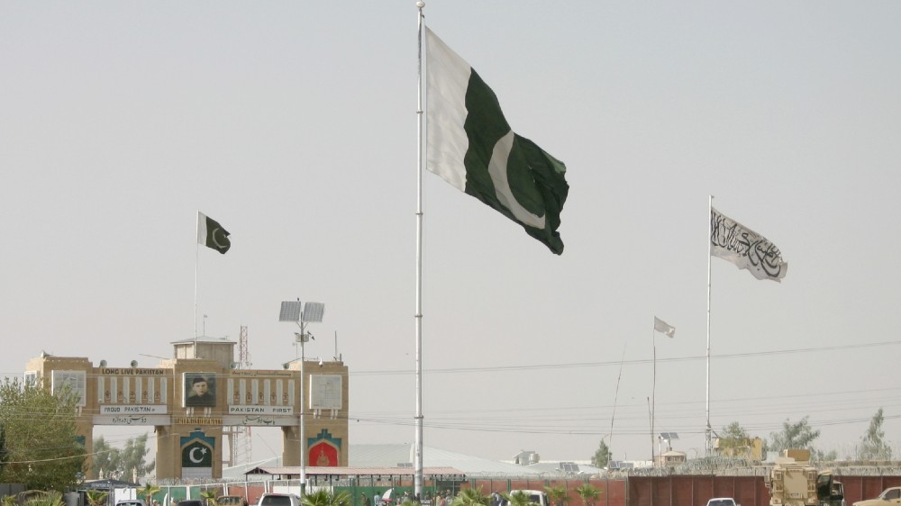 General view of Pakistan and Taliban flags.