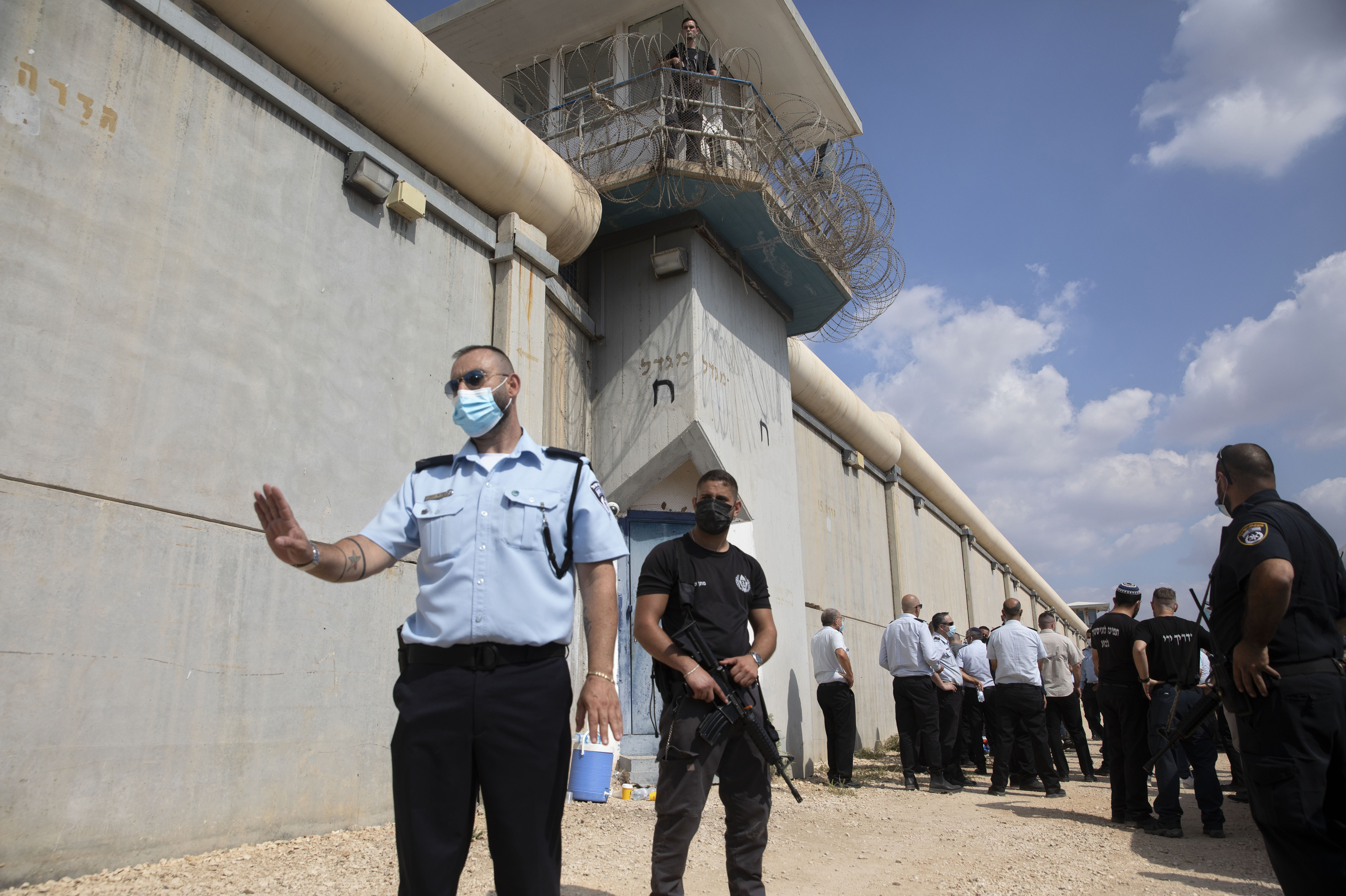 Police officers and prison guards inspect the scene of a prison escape outside the Gilboa prison in northern Israel [Sebastian Scheiner/AP Photo]