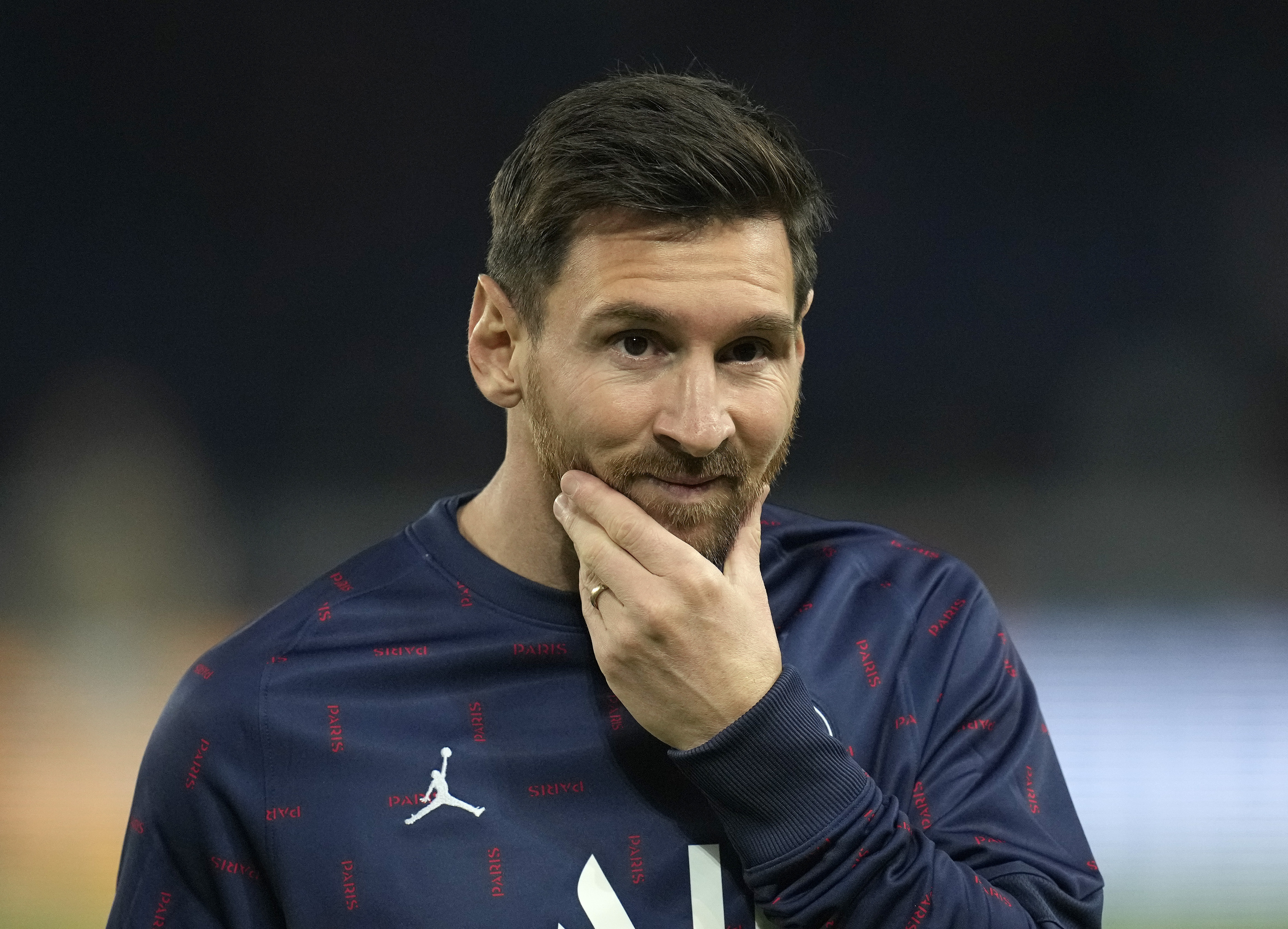 PSG''s Lionel Messi strokes his chin during the warm-up before the Champions League Group A soccer match between Paris Saint-Germain and Manchester City at the Parc des Princes in Paris, Tuesday, Sept. 28, 2021