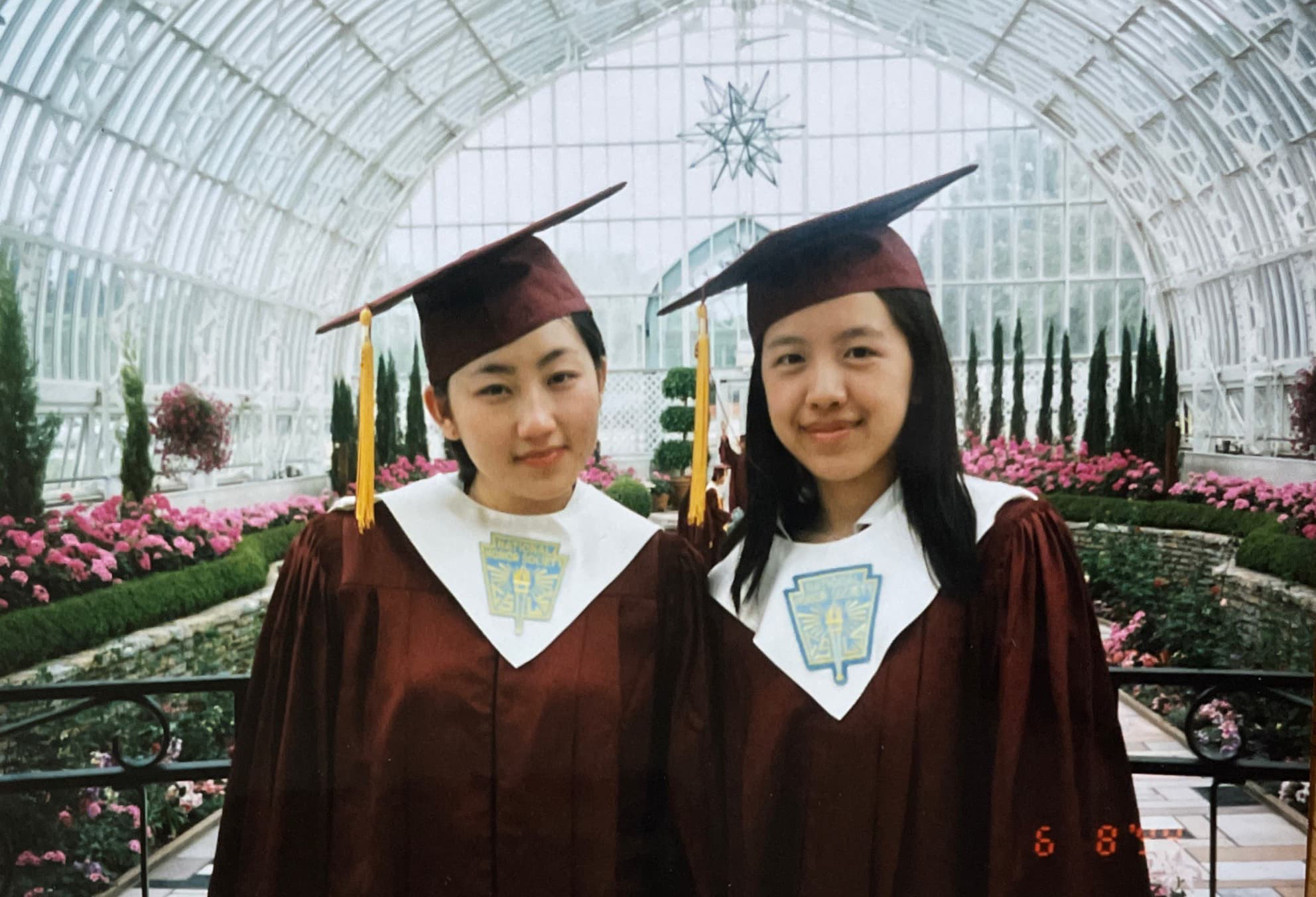 The author, left, with her childhood friend, Julia Chang, on their high school graduation day [Photo courtesy of Kao Kalia Yang]