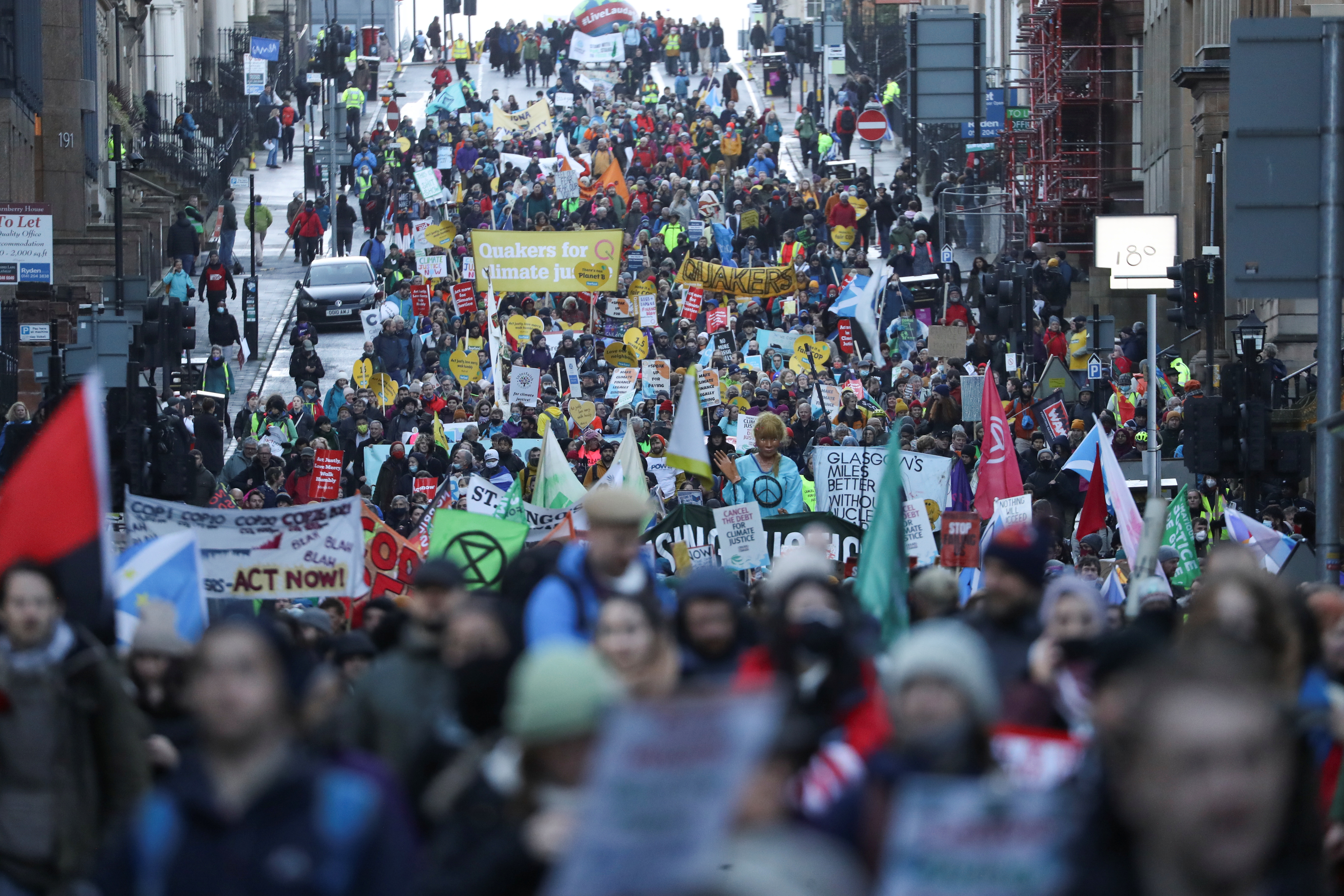 People take part in a protest against the UN Climate Change Conference (COP26), in Glasgow, Scotland on November 6, 2021 [Reuters/Russell Cheyne]