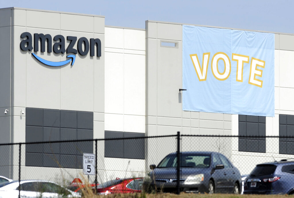 a banner encouraging workers to vote in labor balloting is shown at an Amazon warehouse in Bessemer, Ala., US