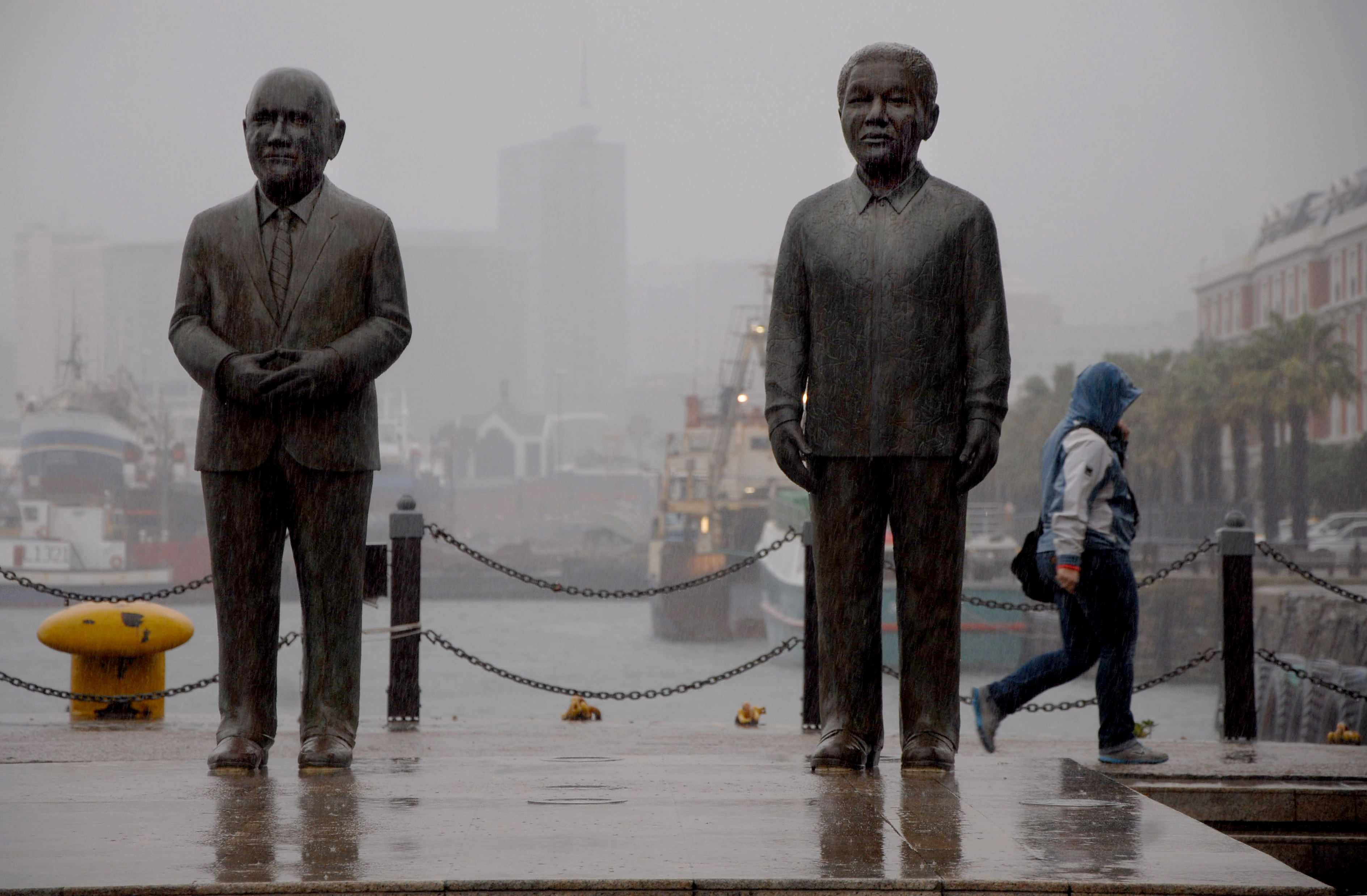 A statue of FW de Klerk, left, stands next to a statue of South Africa's first Black President Nelson Mandela at the Victoria and Alfred Waterfront in Cape Town [File: AP/Masixole Feni]