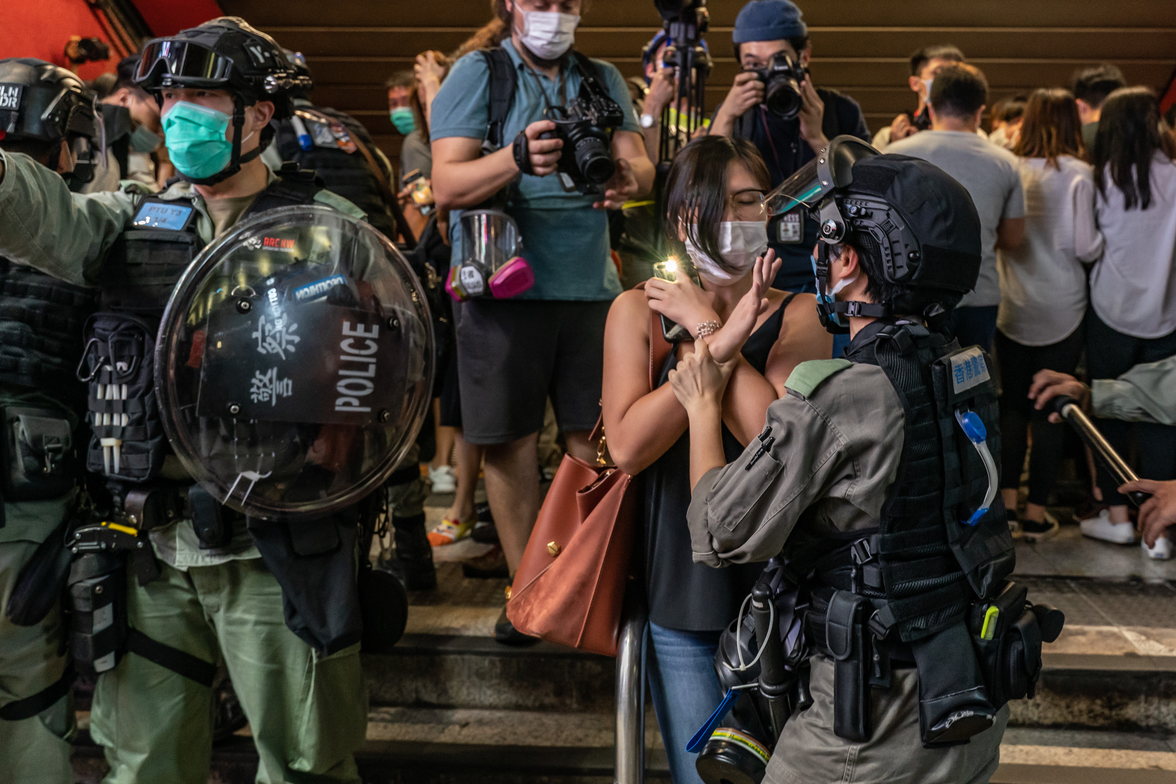 Riot police detain a pro-democracy supporter during an anti-national security law rally in Mongkok district on June 12, 2020, in Hong Kong [File: Anthony Kwan/Getty Images]