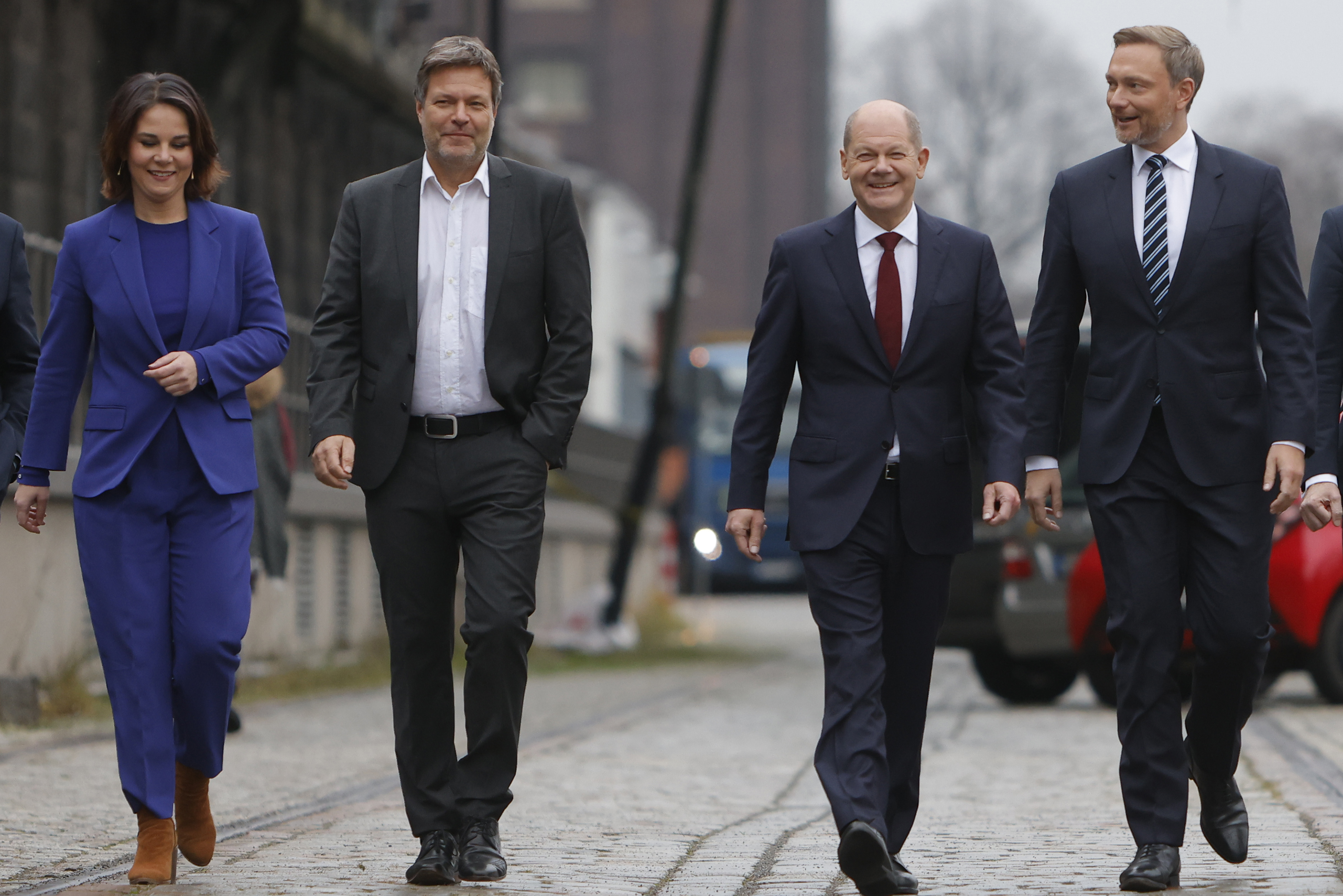 Christian Lindner, leader of the Free Democratic Party (FDP), far right, Olaf Scholz, SPD member and likely next German chancellor, third from left, Annalene Baerbock, left, and Robert Habeck, second from left, co-leaders of the Greens Party, arrive to present their mutually agreed upon coalition contract in Berlin [Michele Tantussi/Getty Images]