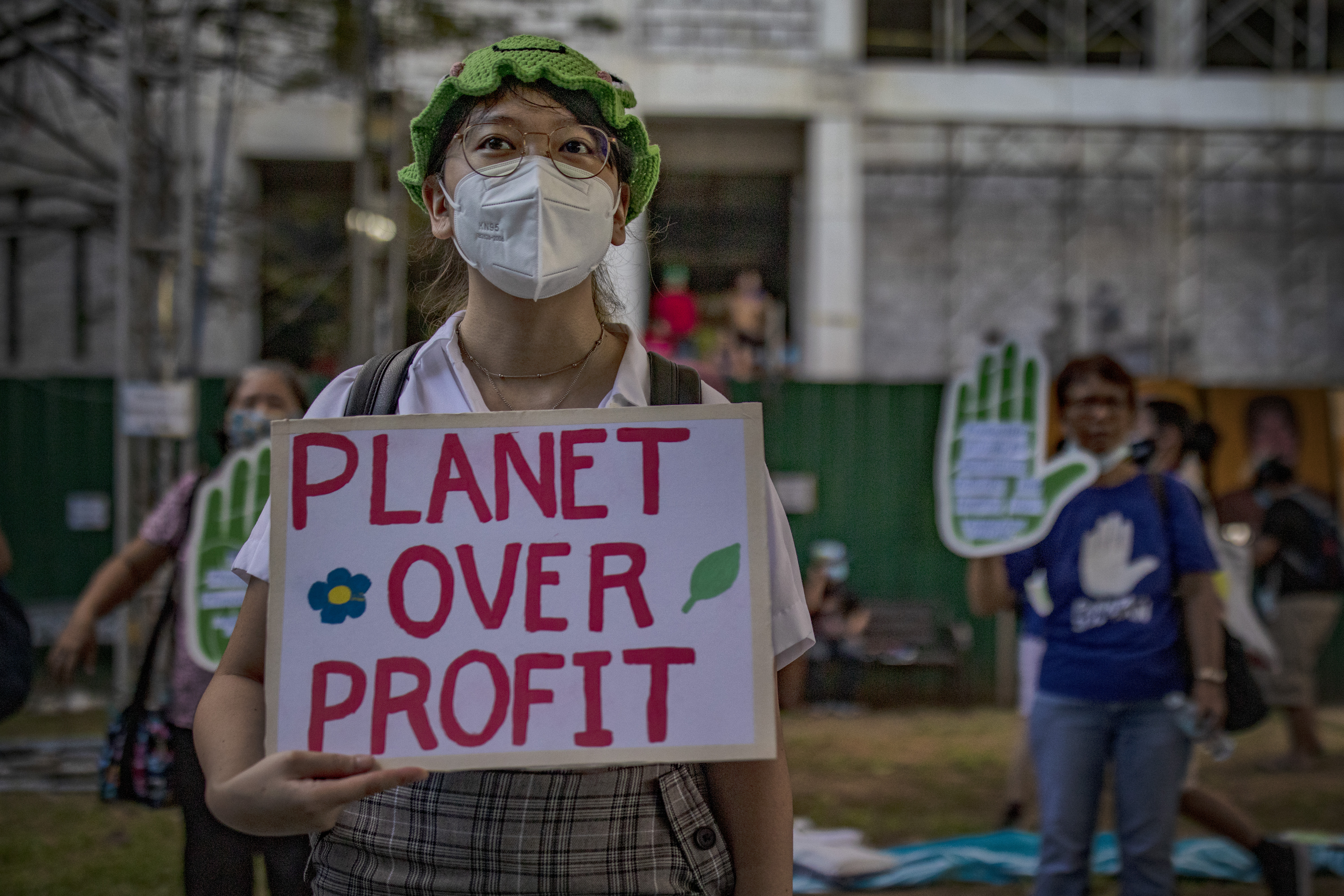 A climate activist takes part in the Global Day of Action for Climate Justice protest on November 6 in Quezon City, Philippines, which is one of the third deadliest countries in the world for environment and land defenders opposing industries such as mining and logging [File: Getty Images/Ezra Acayan]