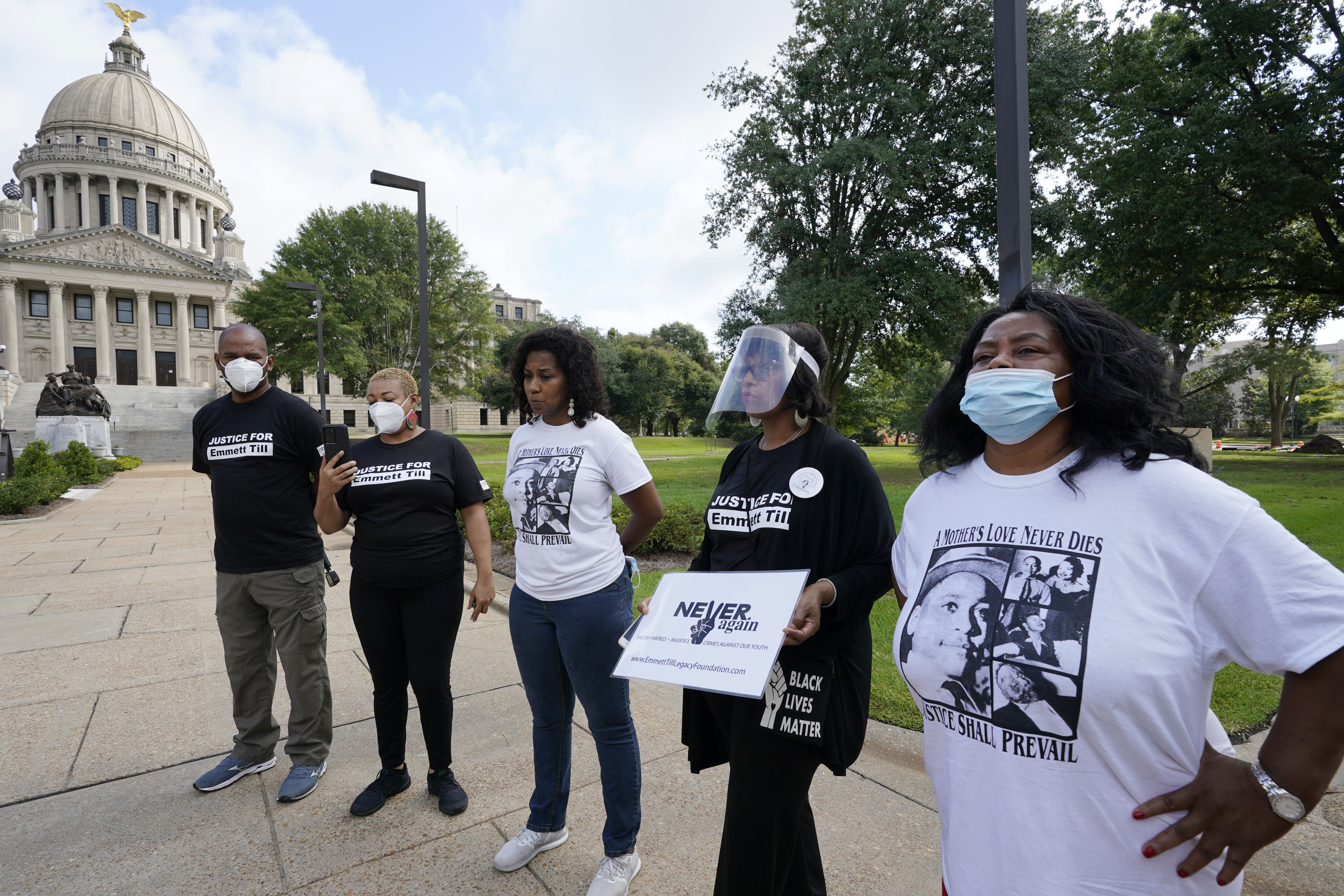Family and foundation members speak outside the Mississippi State Capitol in Jackson, Miss., Saturday, Aug. 29, 2020, prior to marching around the building commemorating the legacy of Emmett Till, a Black teenager who was killed in Money, Miss., 65 years ago for allegedly whistling at Carolyn Bryant, the wife of a white store owner in the town. The teenager was kidnapped from his great uncle's home and was later found dead in the Tallahatchie River. The violent nature of his death and subsequent public display of his body at his funeral helped galvanized the Civil Rights movement. (AP Photo/Rogelio V. Solis)