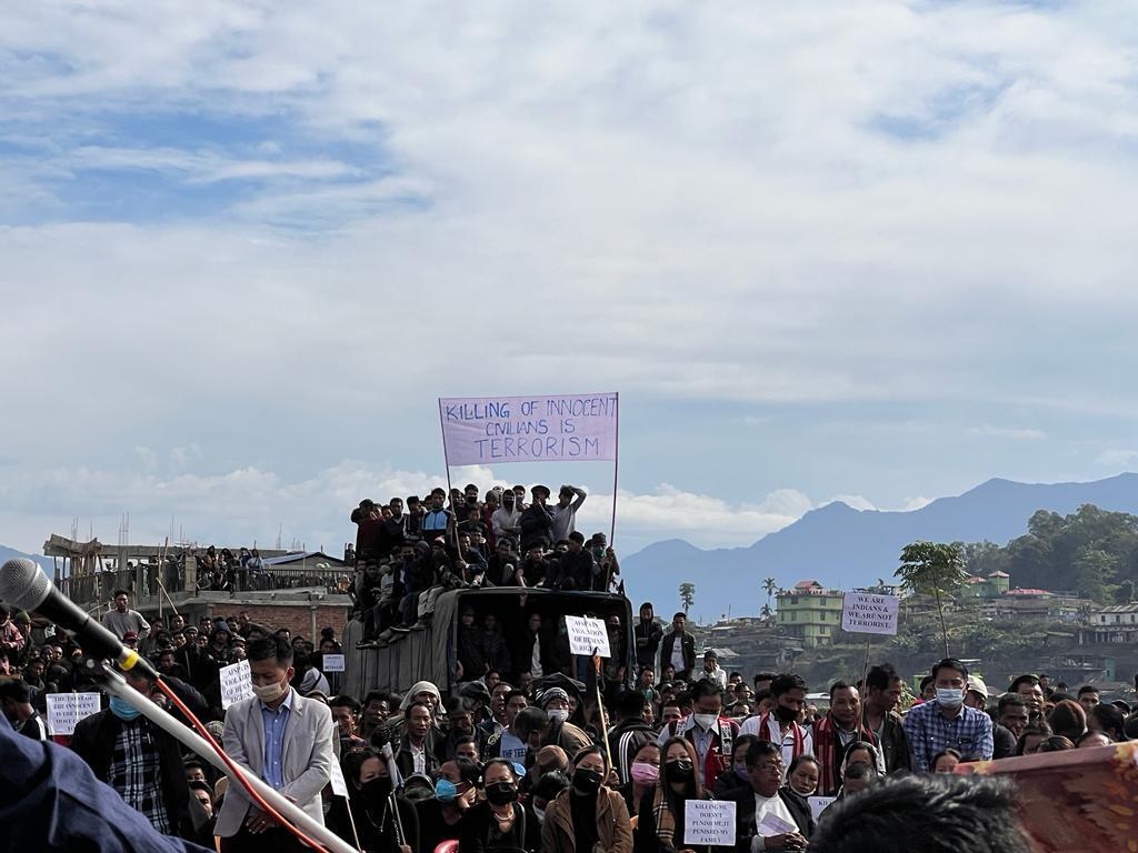 People attend the funeral of civilians killed by Indian army soldiers in Nagaland last year December