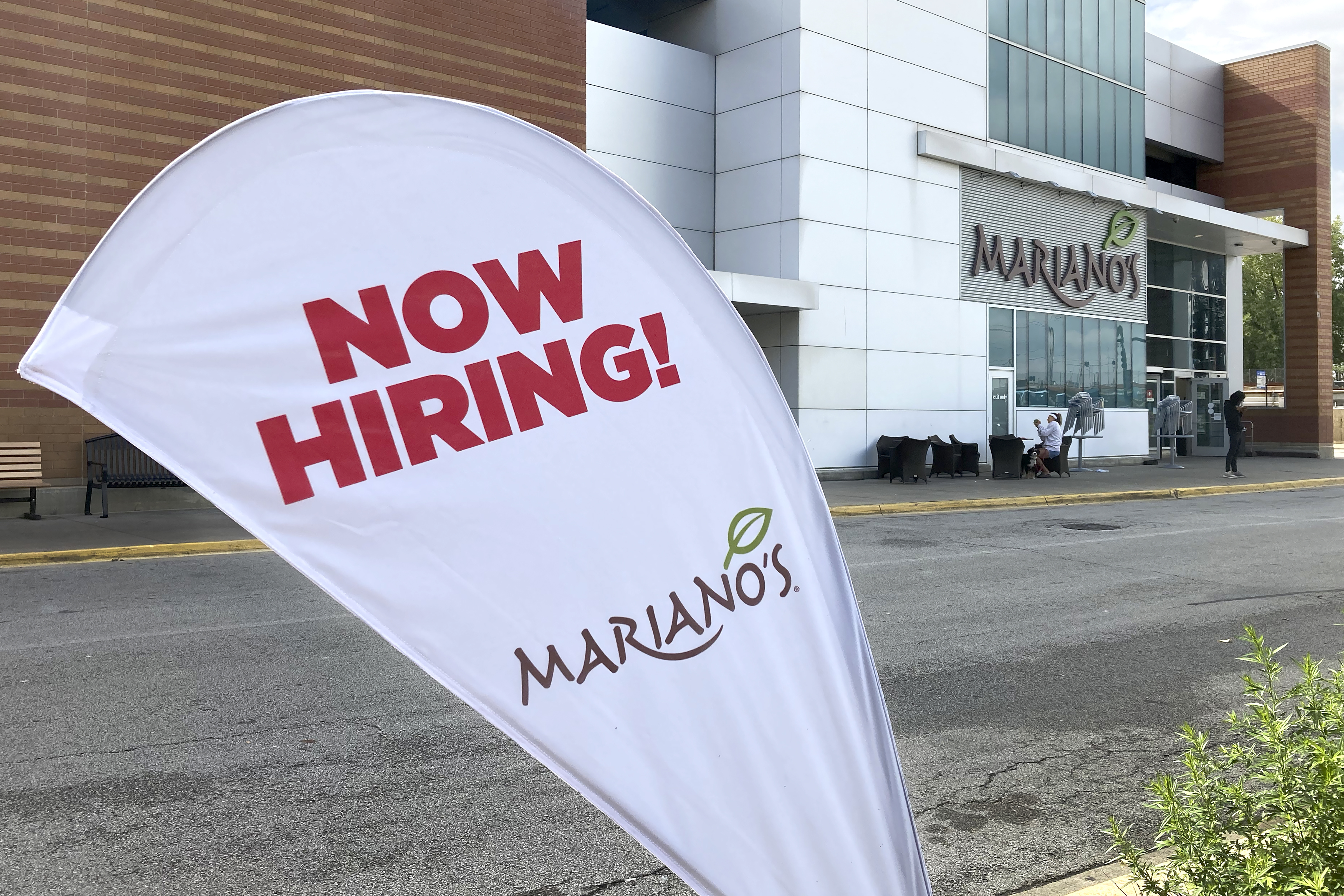 A hiring sign in the parking lot of Mariano's grocery store advertises the availability of jobs, in Chicago, US