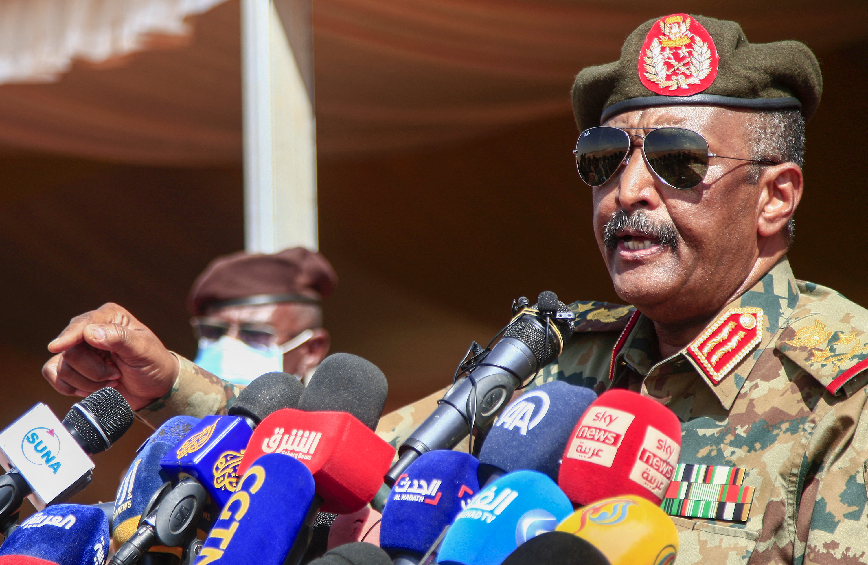 Sudan's top general Abdel Fattah al-Burhan speaks at a military exercise in the Maaqil area in the northern Nile River state, on December 8, 2021