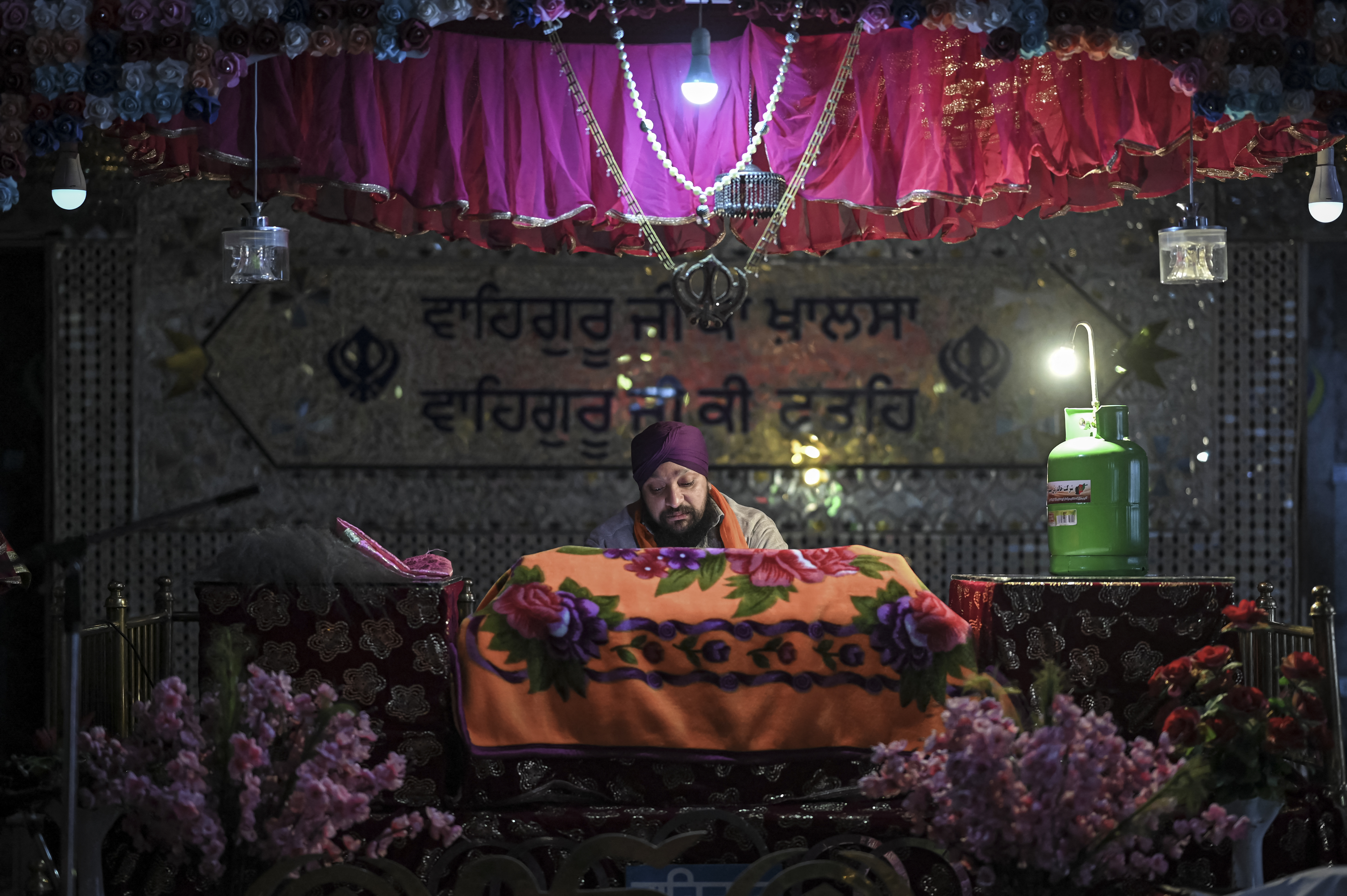 Afghan Sikh priest praying at the Karte Parwan Gurdwara temple in Kabul.