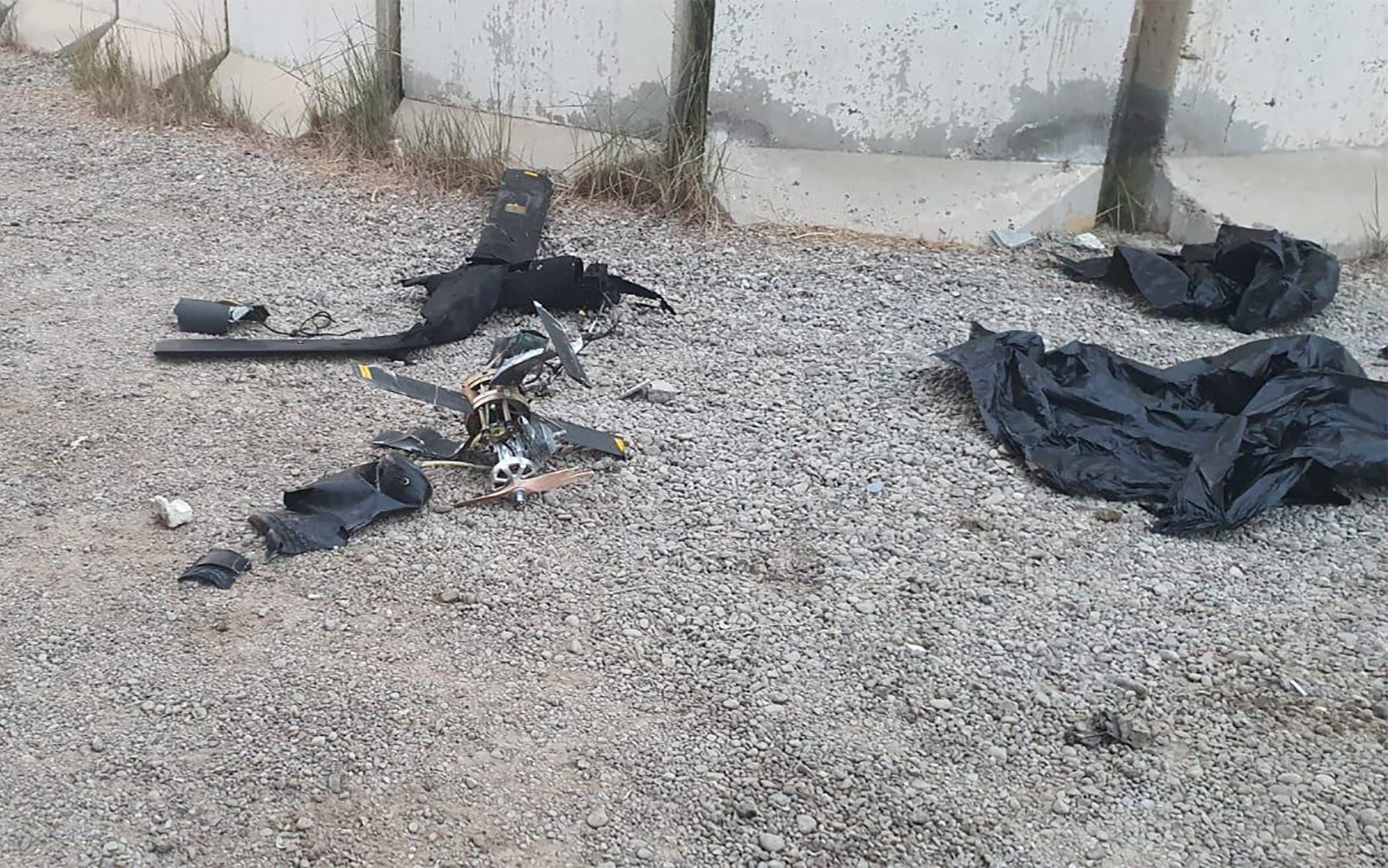 A picture showing what a senior coalition official said are the remains of two armed drones at the site where the US-led coalition against the Islamic State (IS) group in Iraq said it shot down two drones targeting a compound hosting coalition troops at Baghdad airport