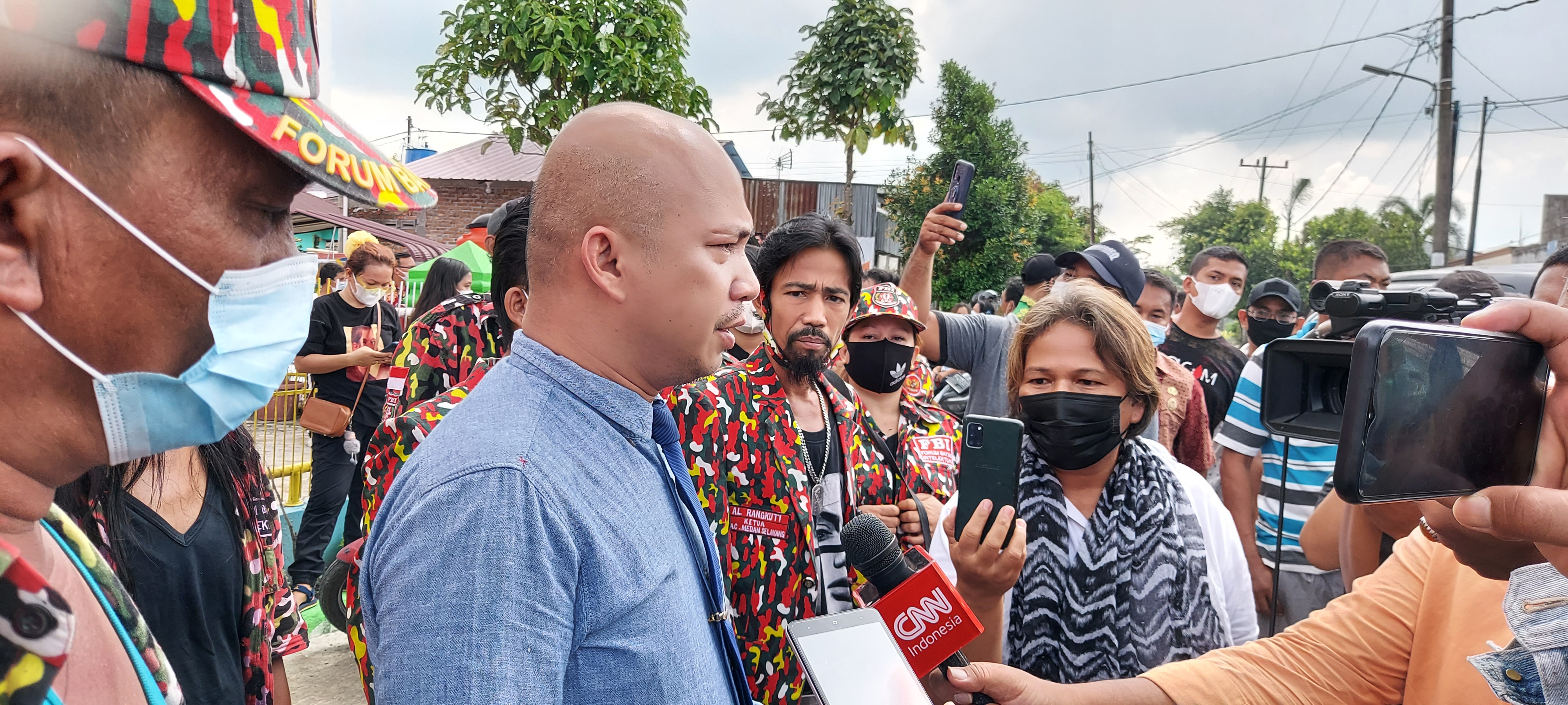 Ranto Sibarani, a human rights lawyer who represented the families, speaks to journalists