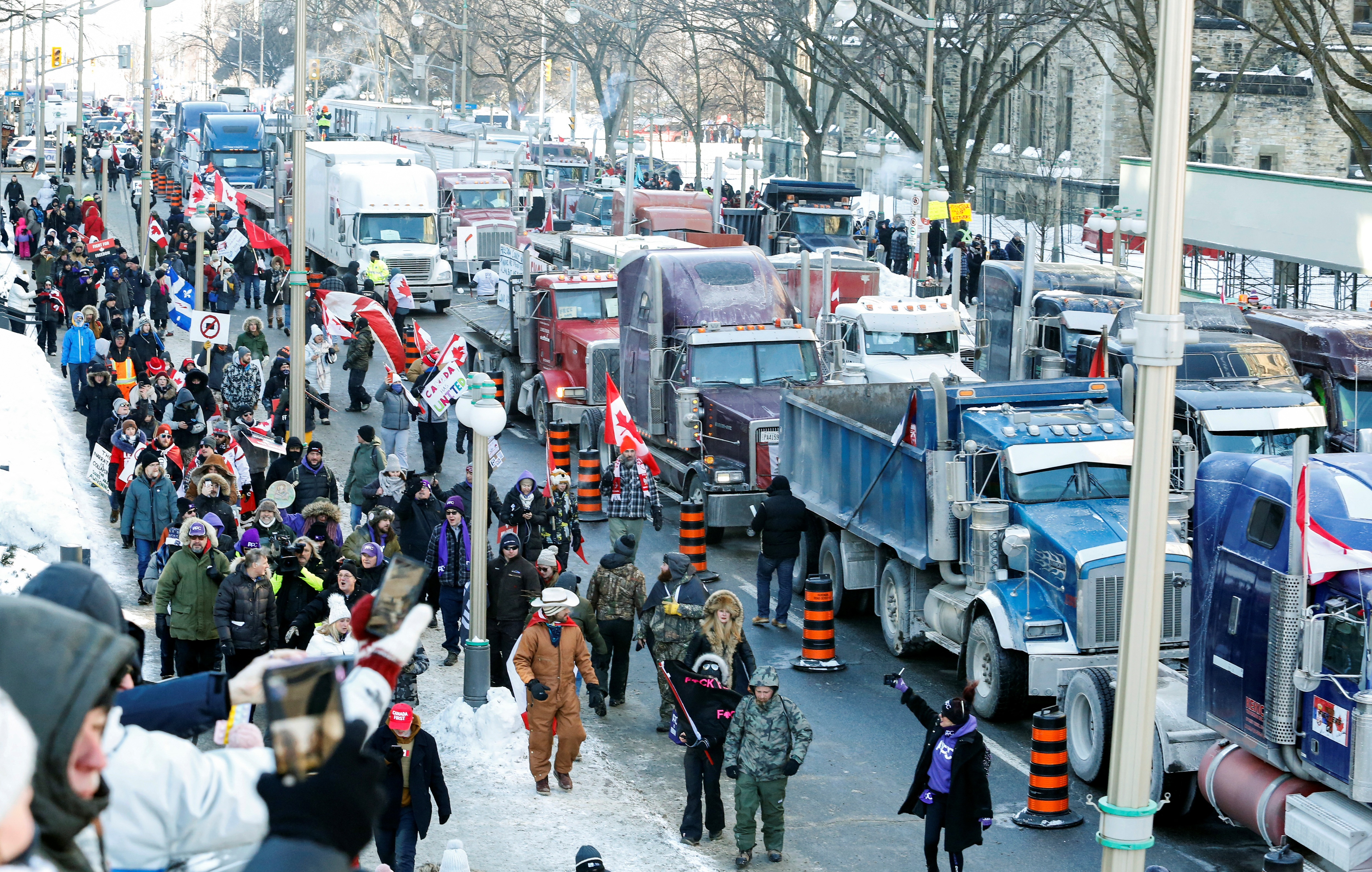 Trucks sit parked on Wellington Street near the parliament buildings