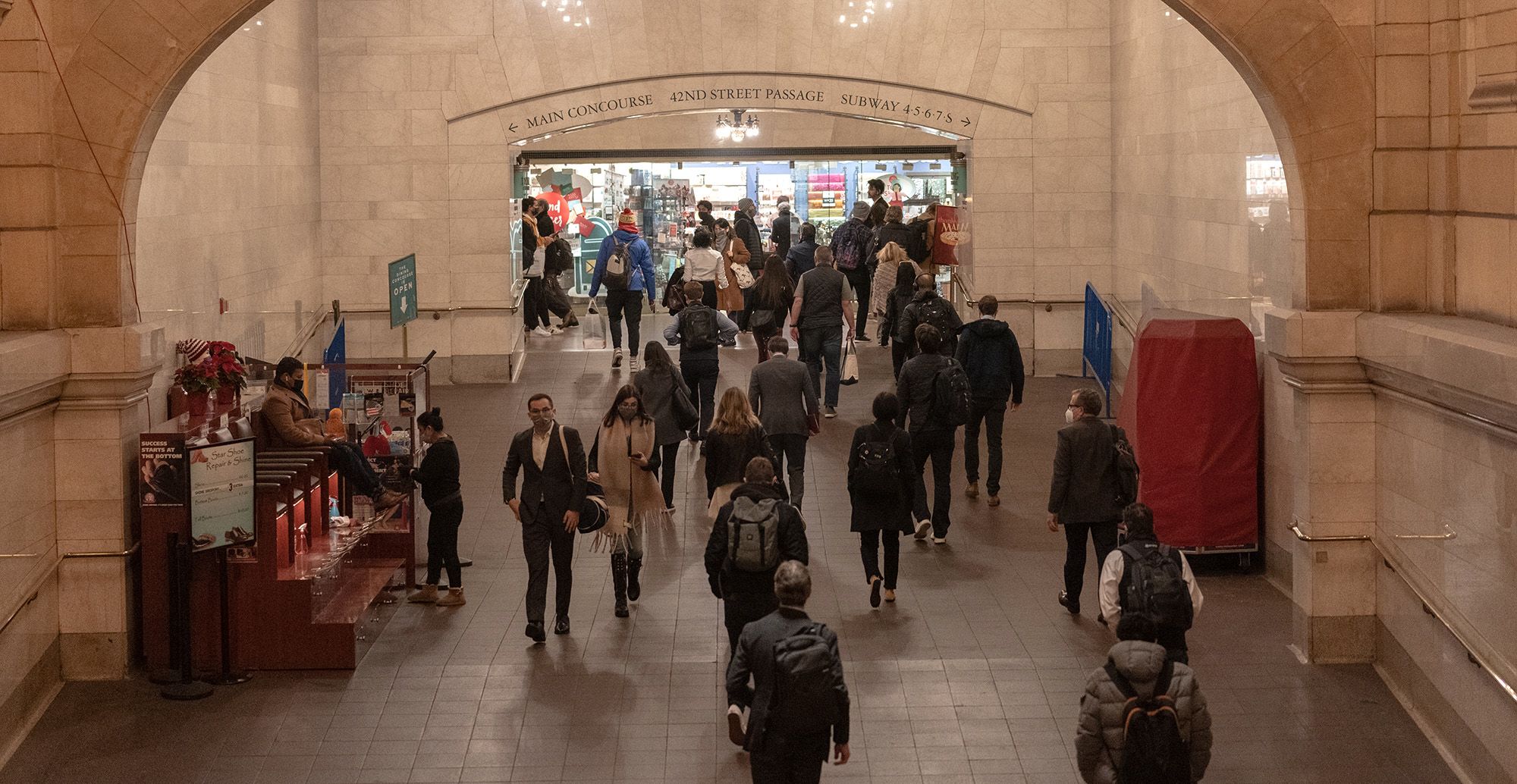 Commuters walk through Grand Central station during morning rush hour in New York