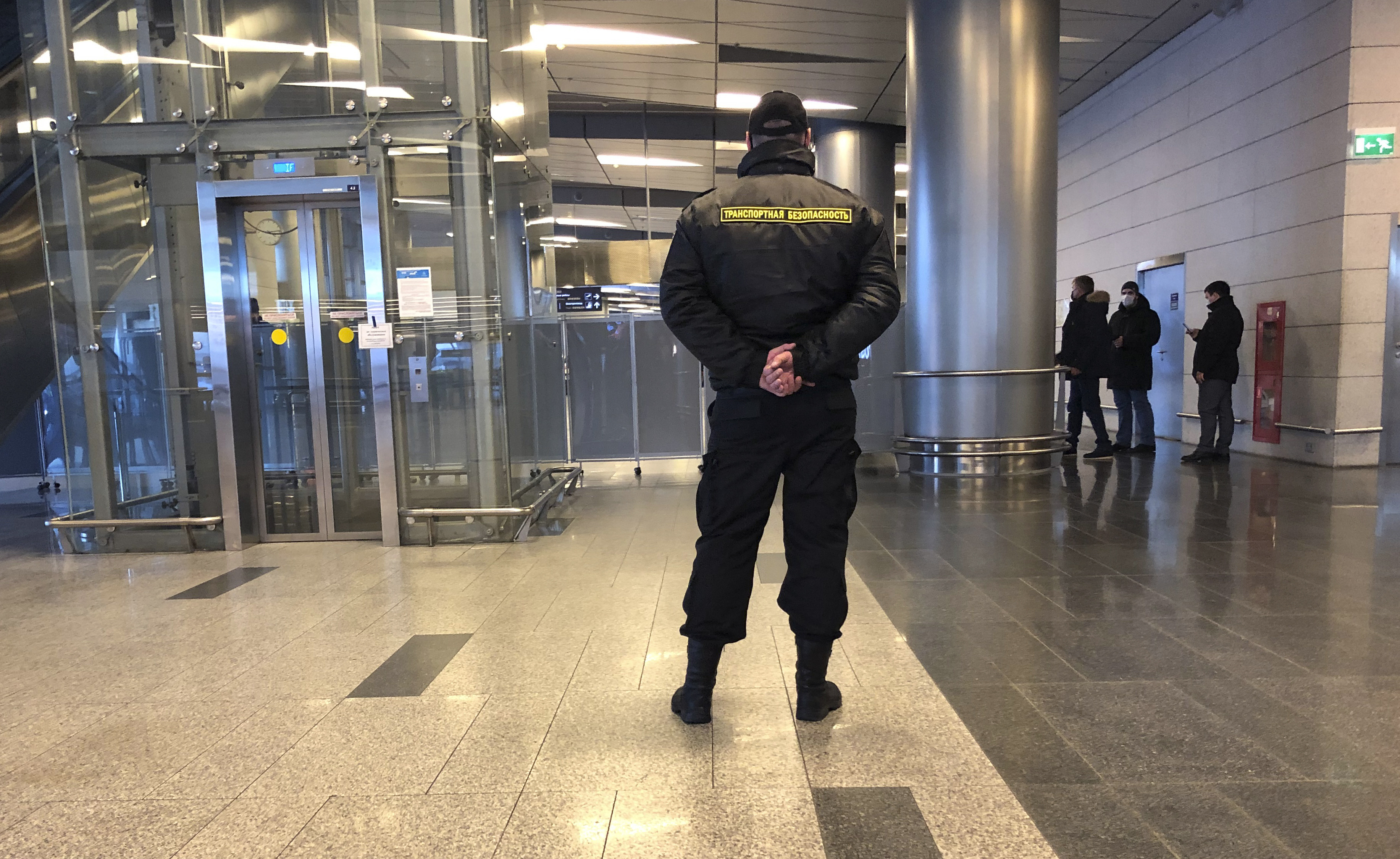 A security stands guard in the arrivals hall in Vnukovo airport