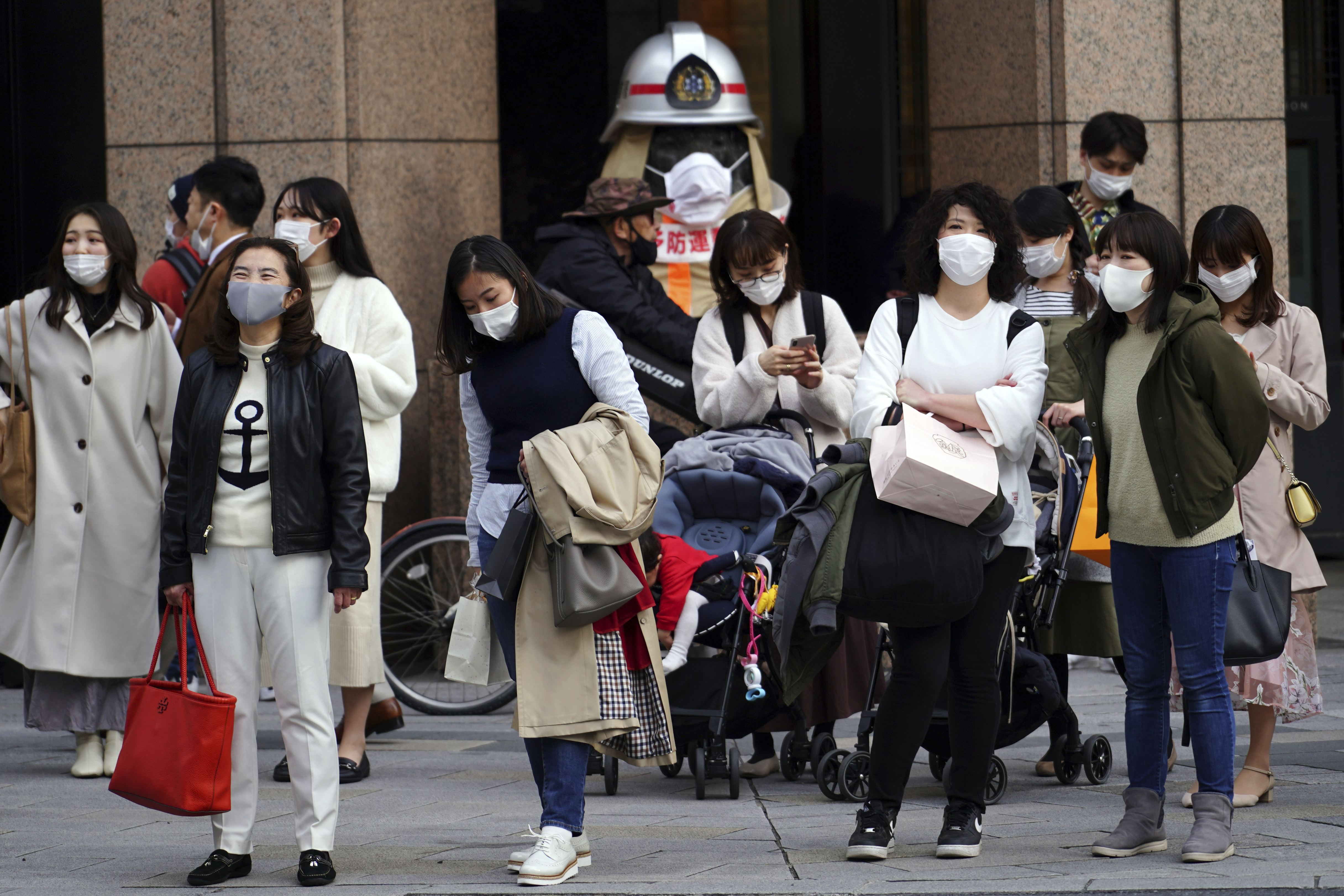 People wearing protective masks to help curb the spread of the coronavirus
