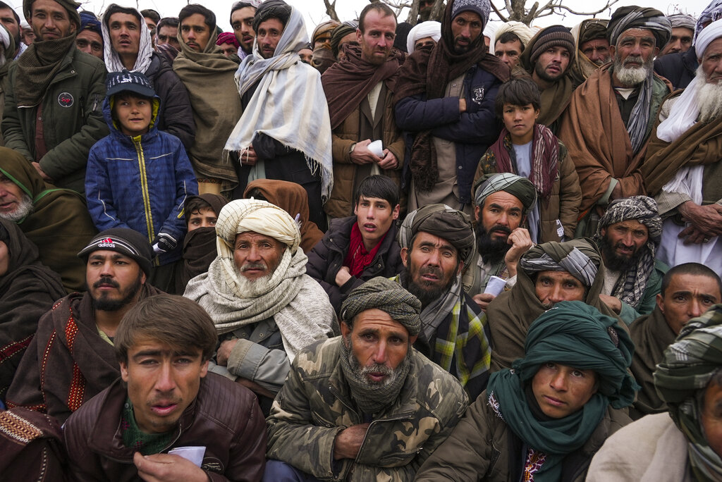 Hundreds of Afghan men gather to apply for the humanitarian aid in Qala-e-Naw, Afghanistan.