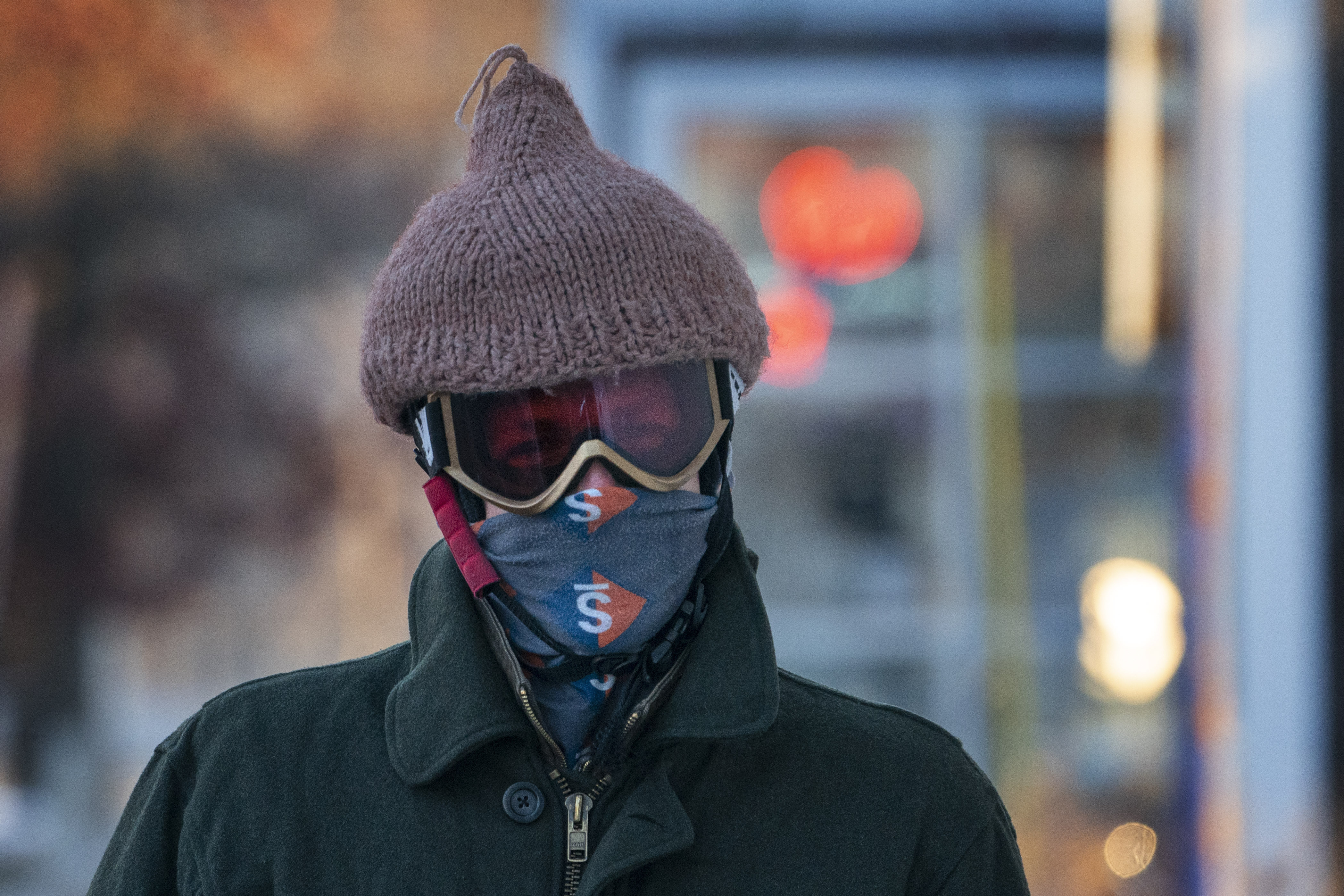 Thomas Nosal wears a hat over his helmet following his daily bicycle commute