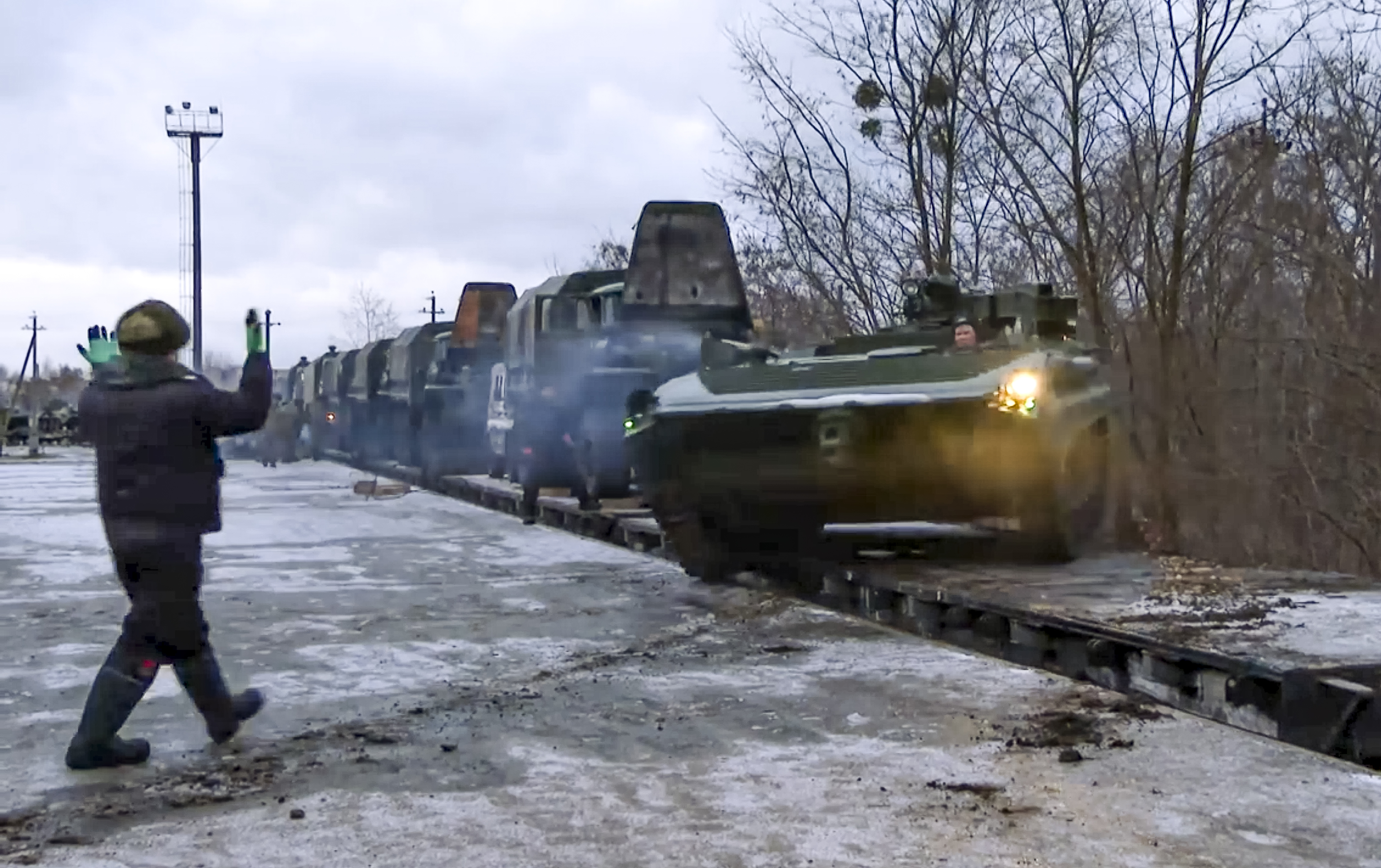 a Russian armoured vehicle drives off a railway platform after arrival in Belarus on January 26