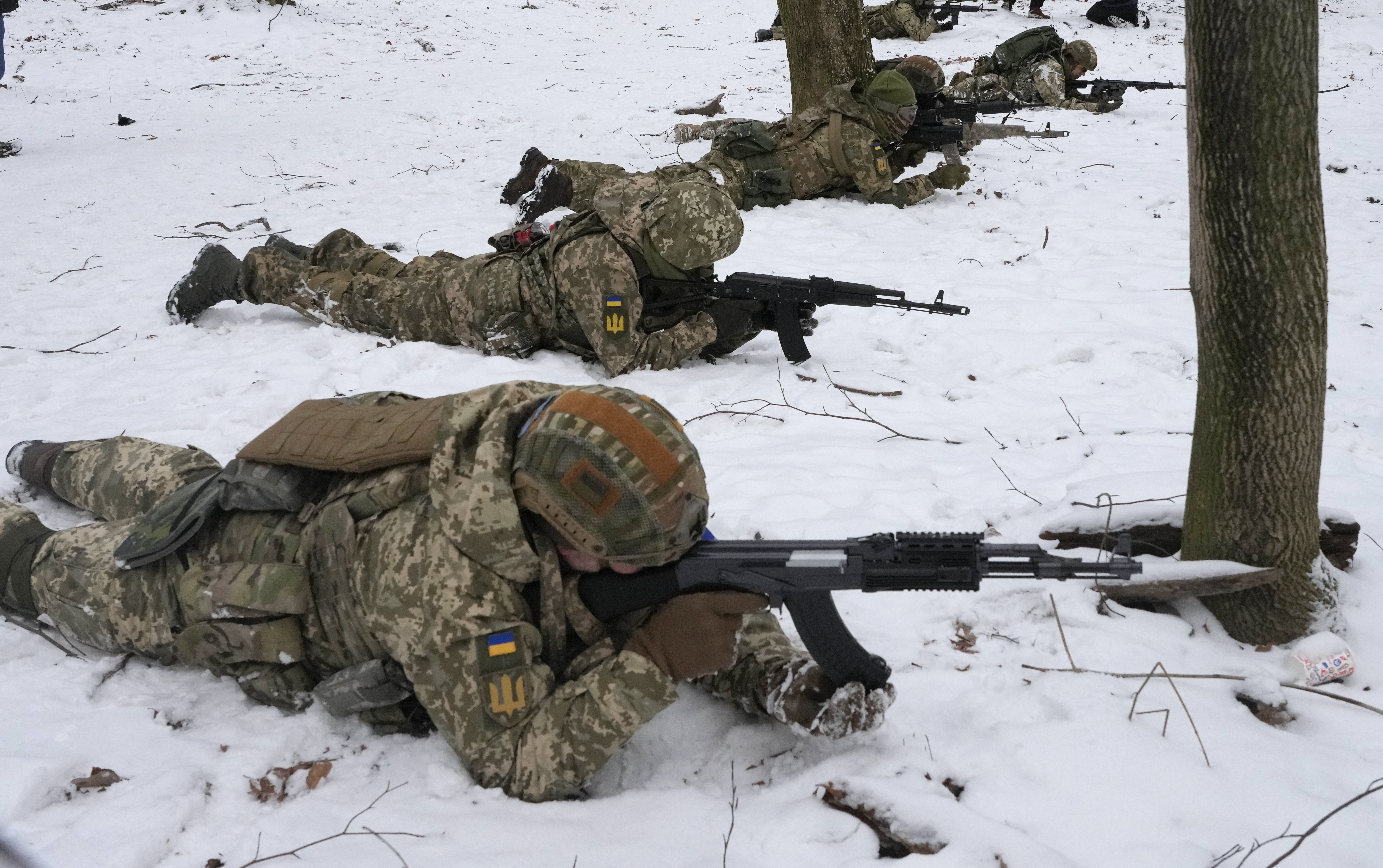 Members of Ukraine's Territorial Defense Forces, volunteer military units of the Armed Forces, train in a city park in Kyiv