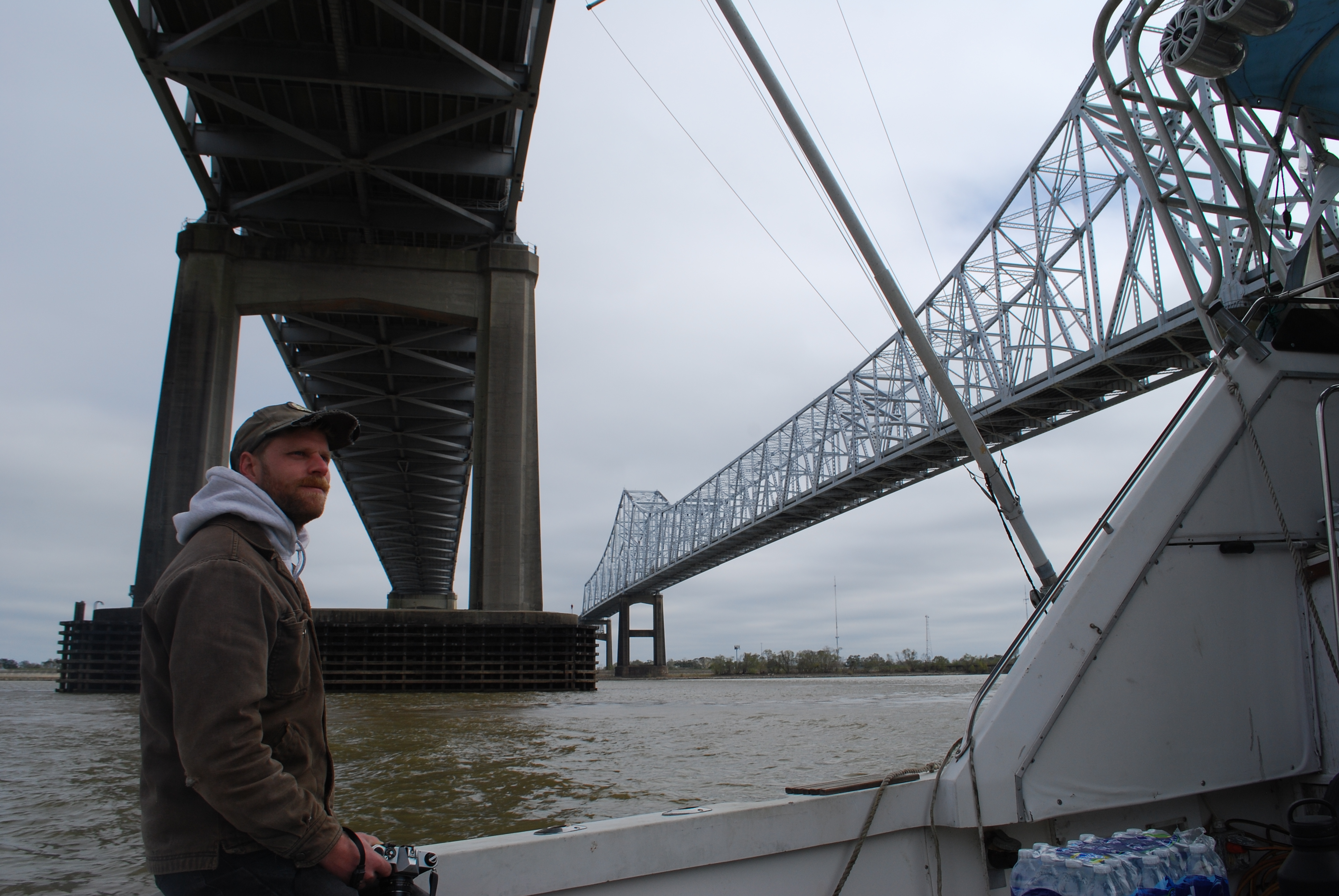 An image of Deckhand Lukas Lacava passing under the Crescent City Connection.