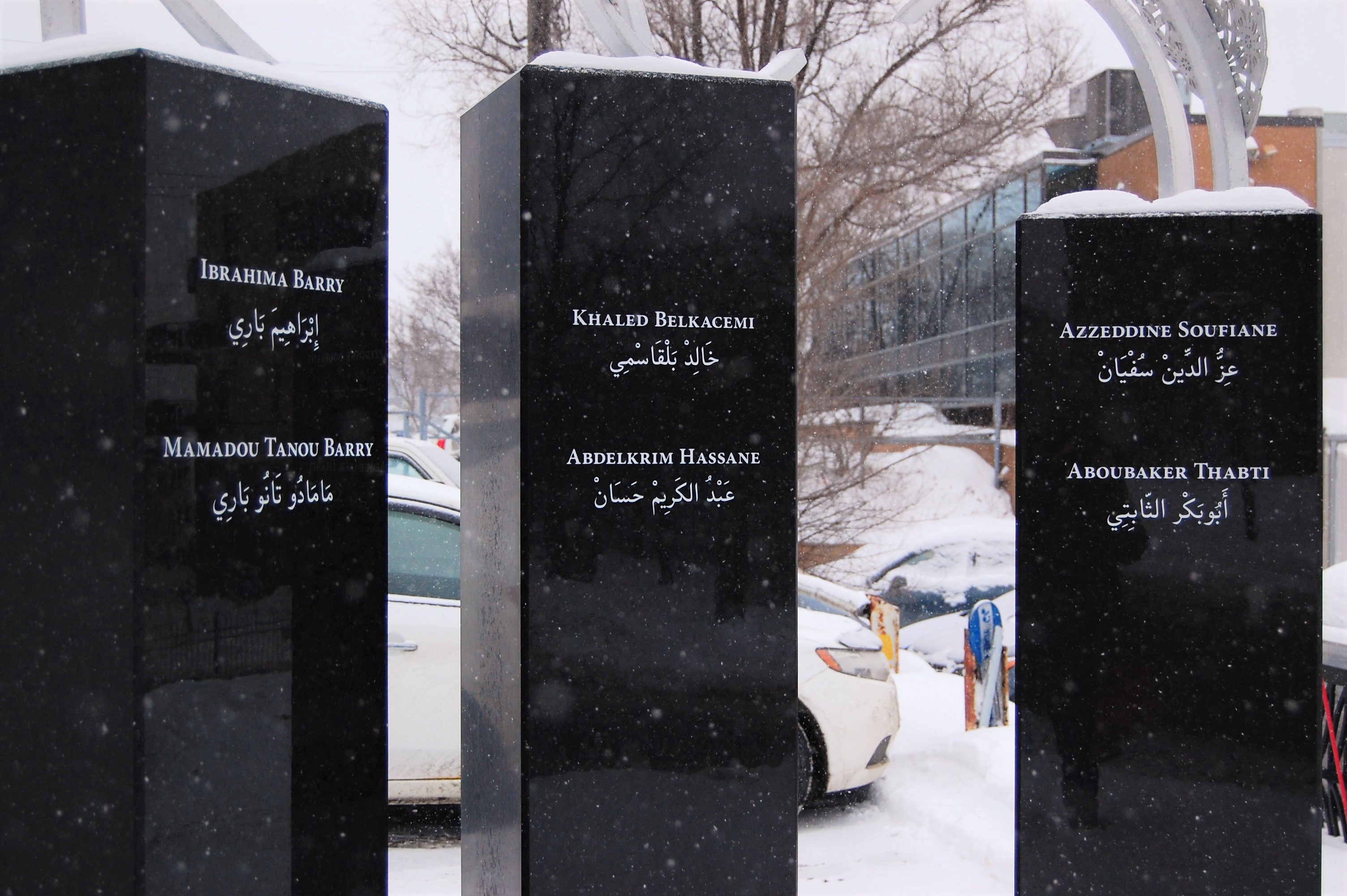 A memorial outside the Quebec City mosque is engraved with the names of six men killed