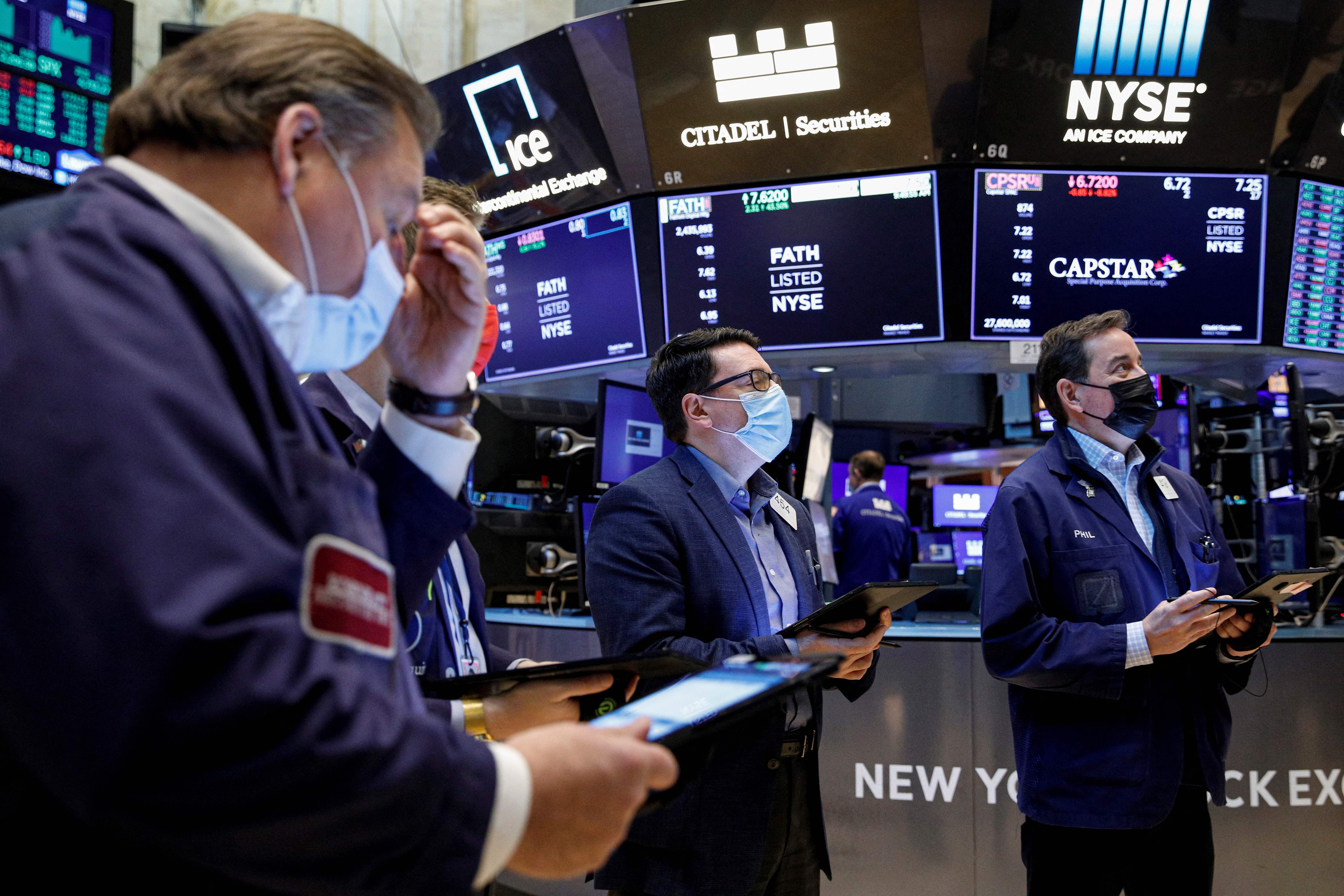 Traders work on the floor of the New York Stock Exchange