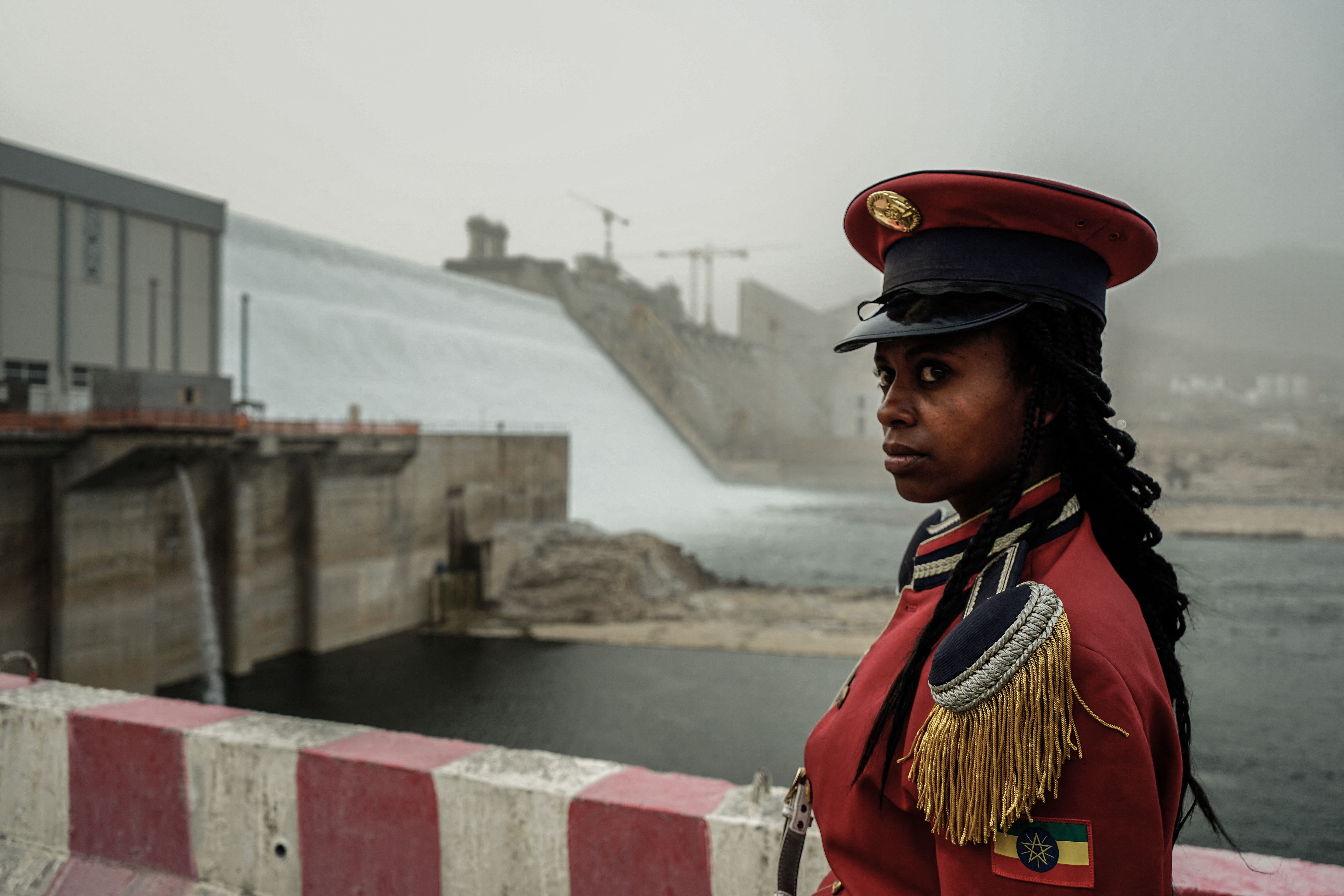 A member of the Republican March Band poses for photo before at the ceremony for the inaugural production of energy at the Grand Ethiopian Renaissance Dam