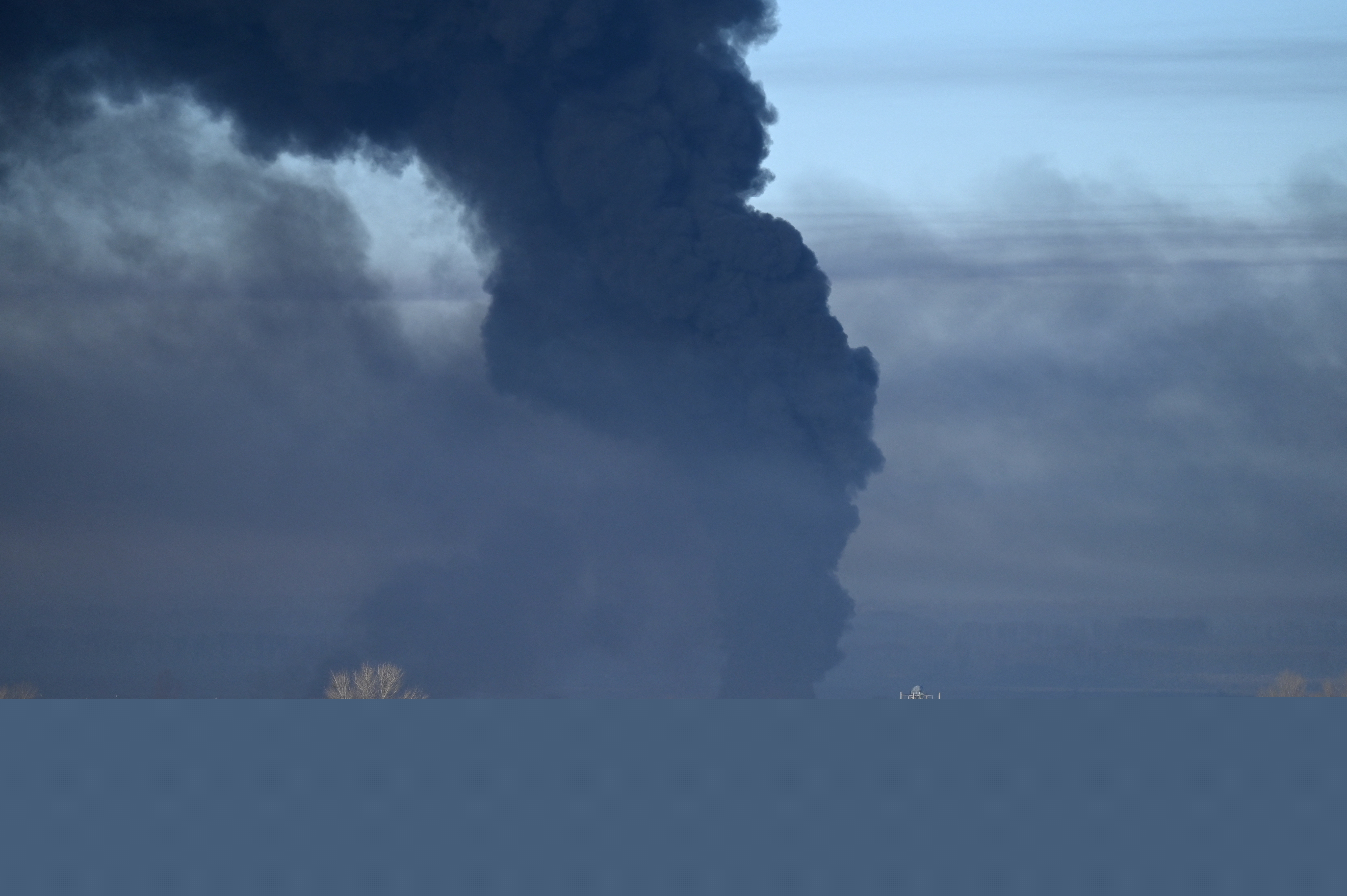 Black smoke rises from a military airport in Chuguyev near Kharkiv