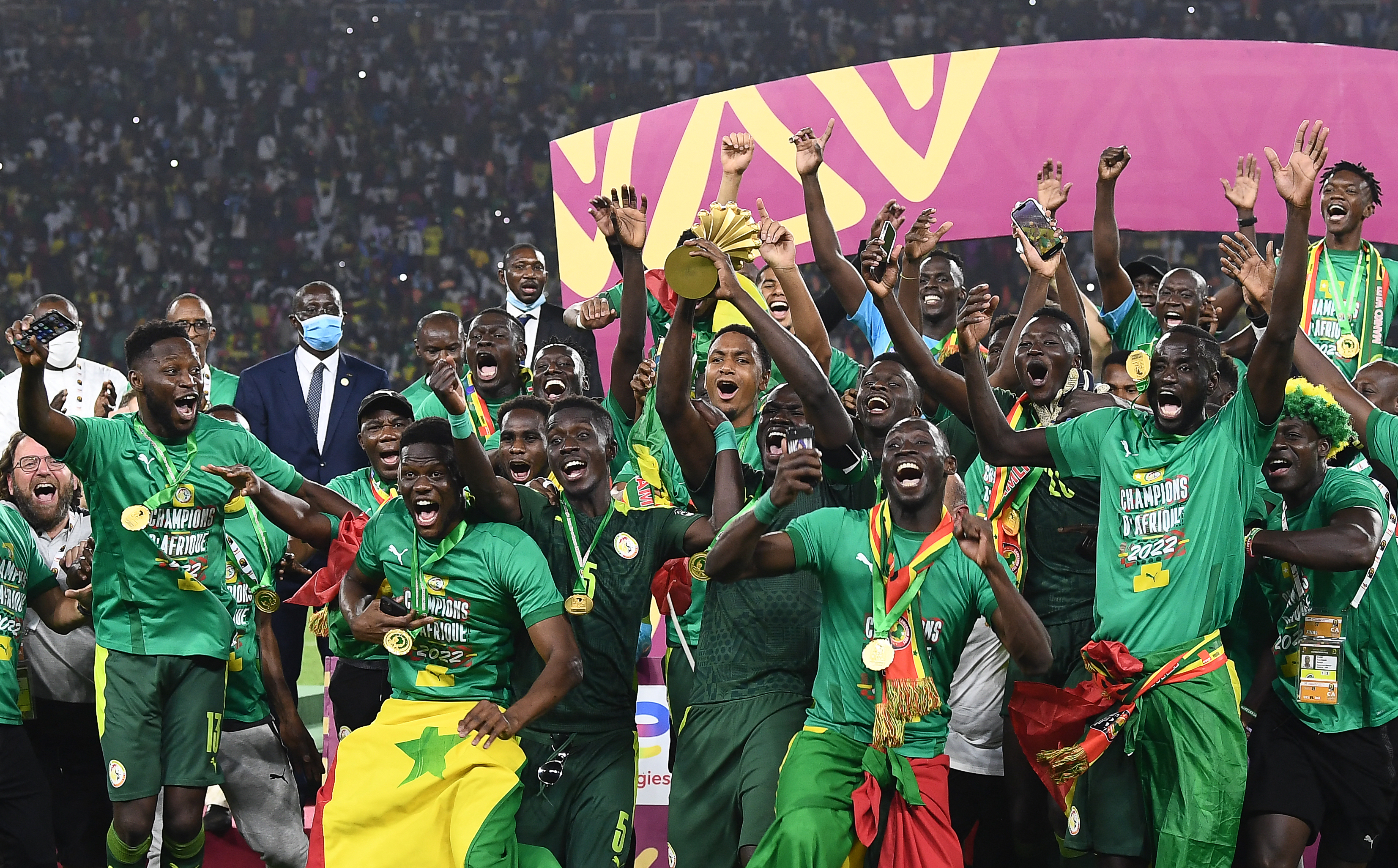 Senegal's players celebrate with the trophy after winning the Africa Cup of Nations 2021 final at Stade d'Olembe in Yaounde.