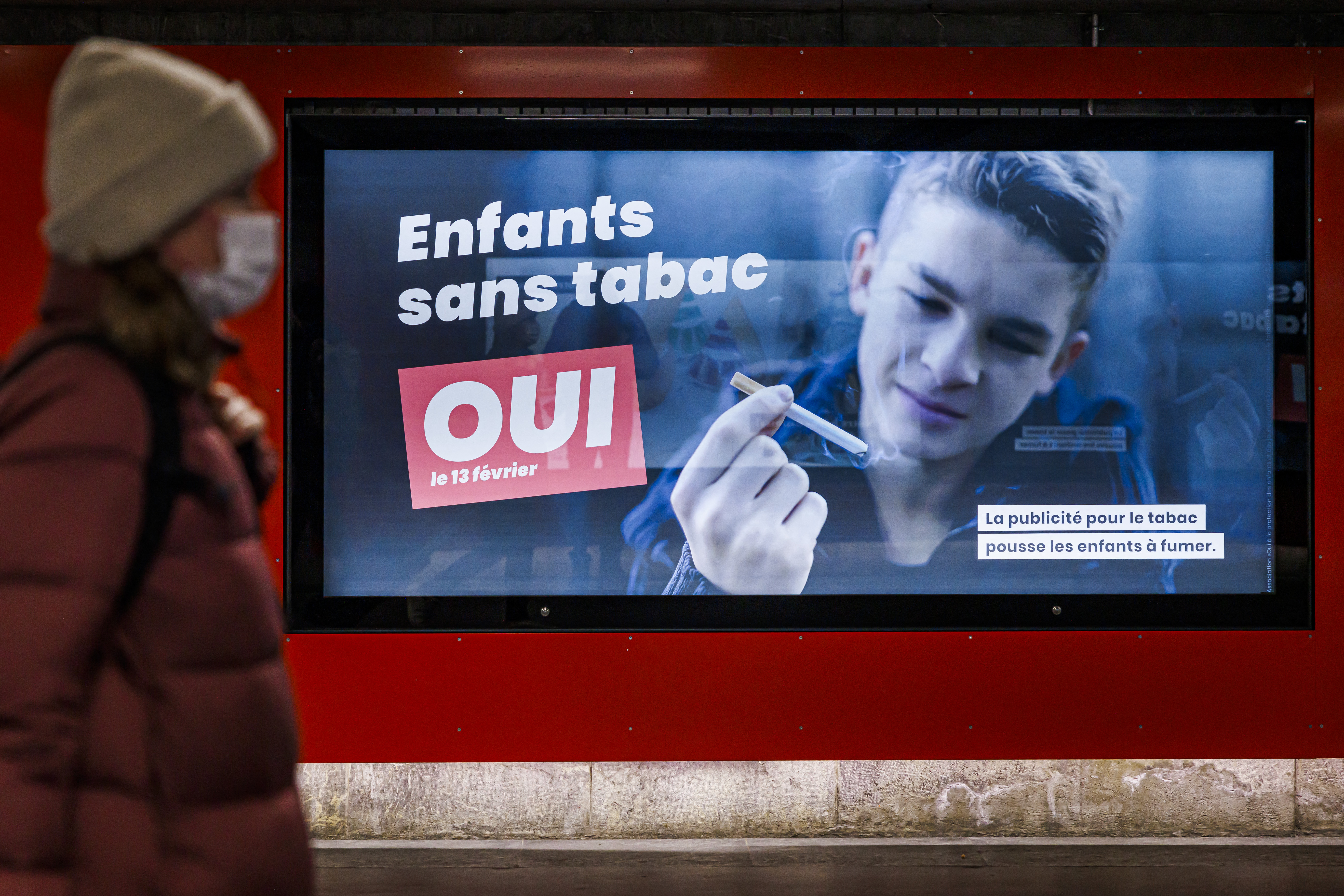 An electoral placard reads in French: "Children without tobacco, YES" in Lausanne