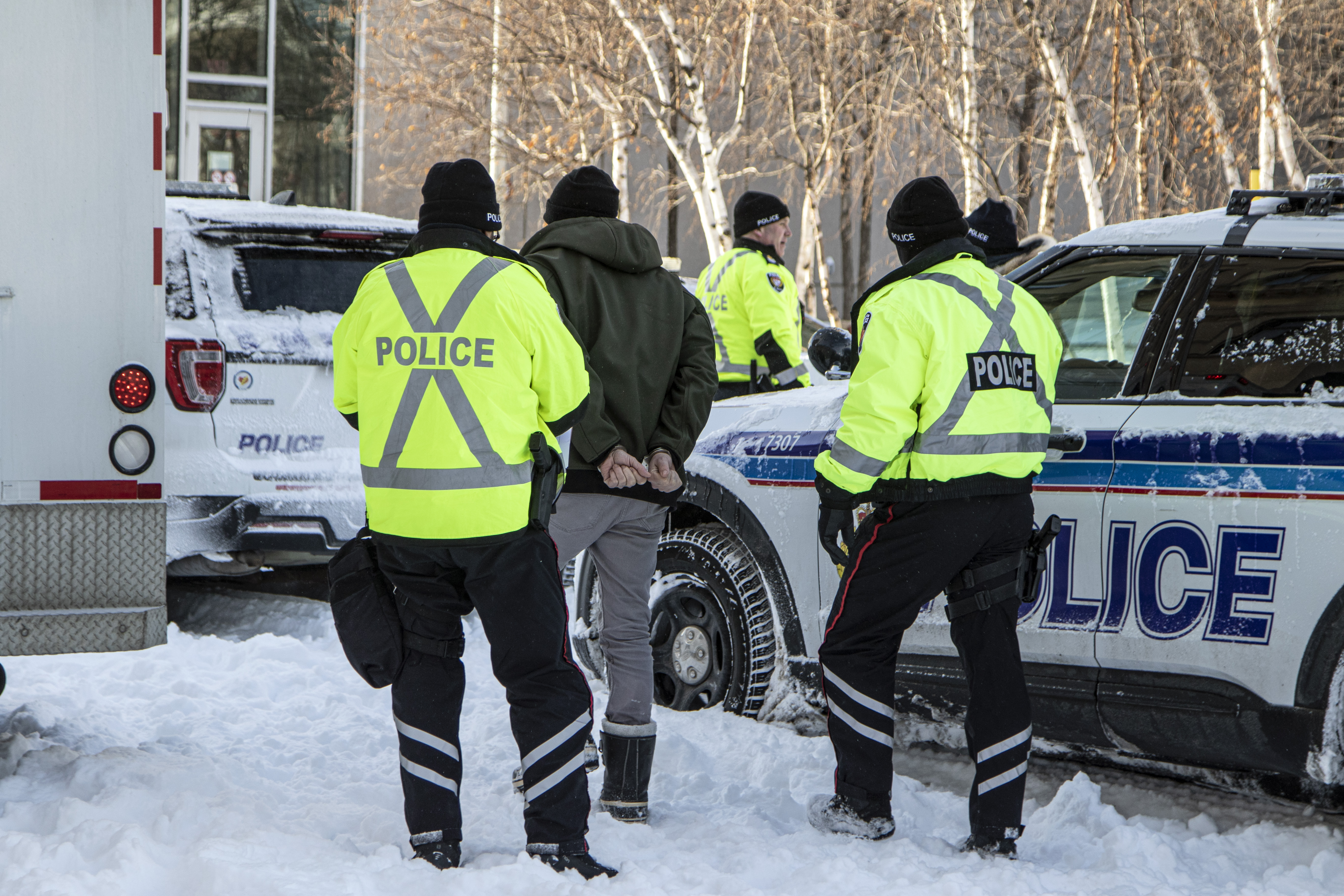 Police officers arrest a man in Ottawa