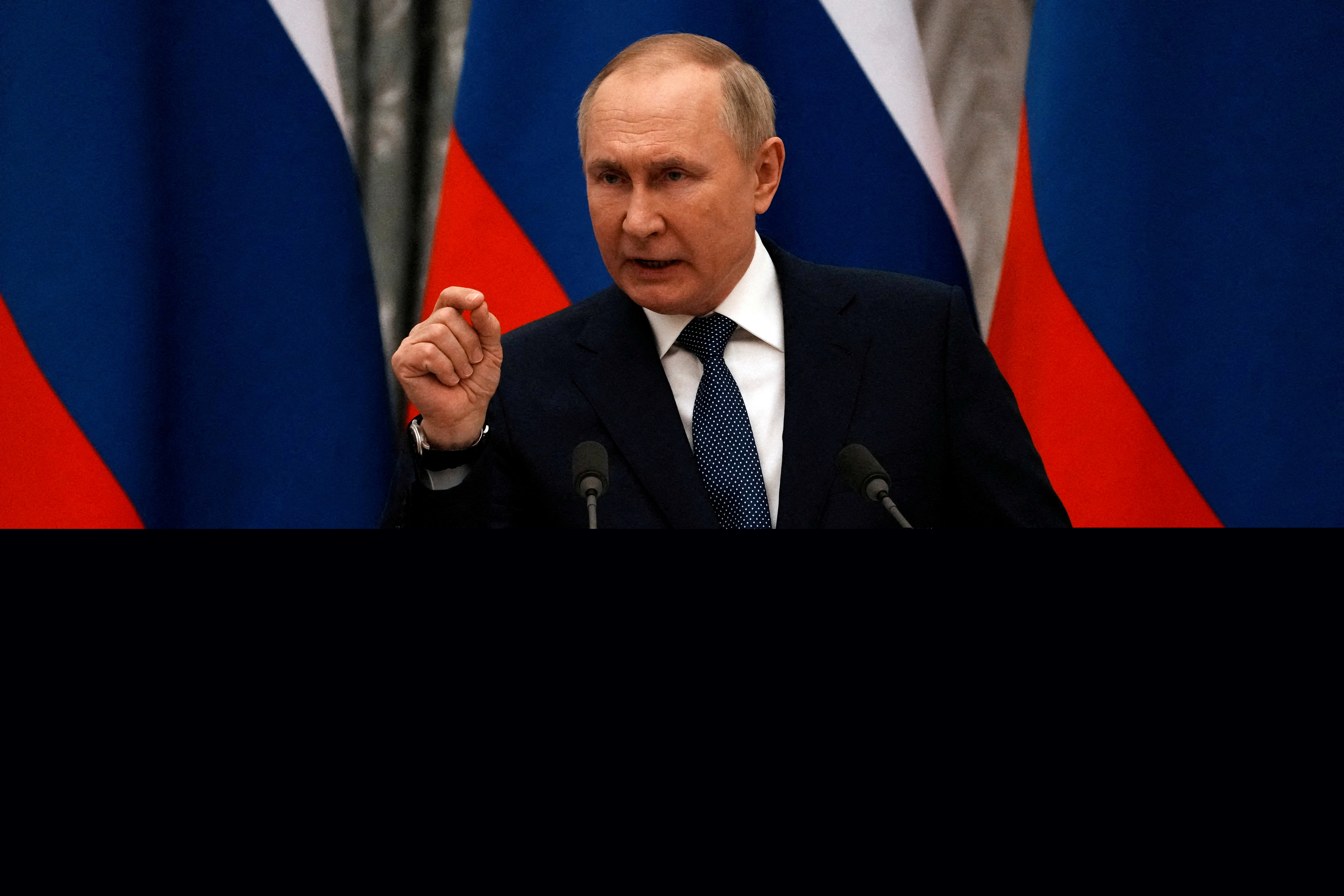 Russian President Vladimir Putin gestures during a press conference with French President Emmanuel Macron, in Moscow.