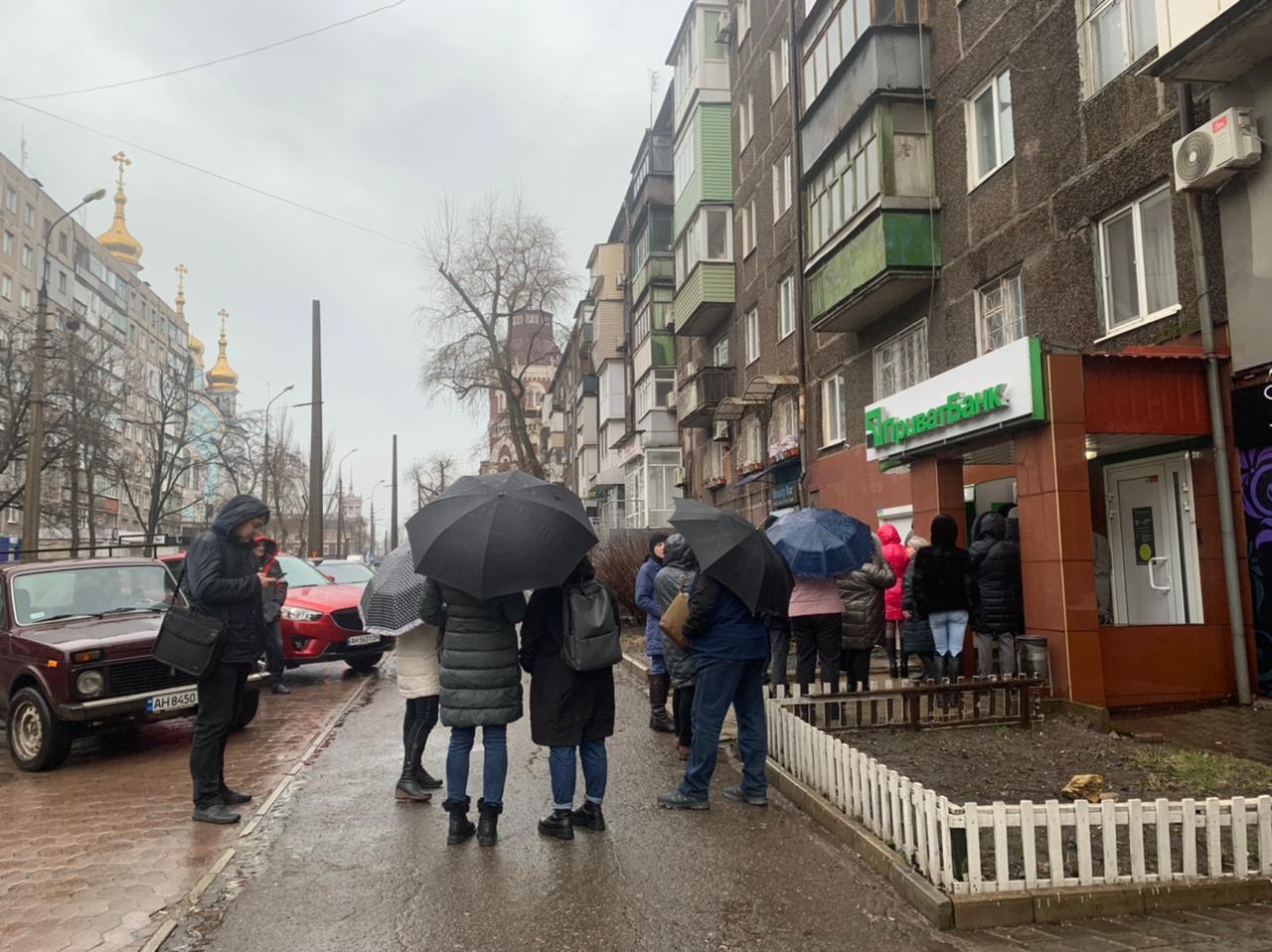 People queue at ATM in Mariupol