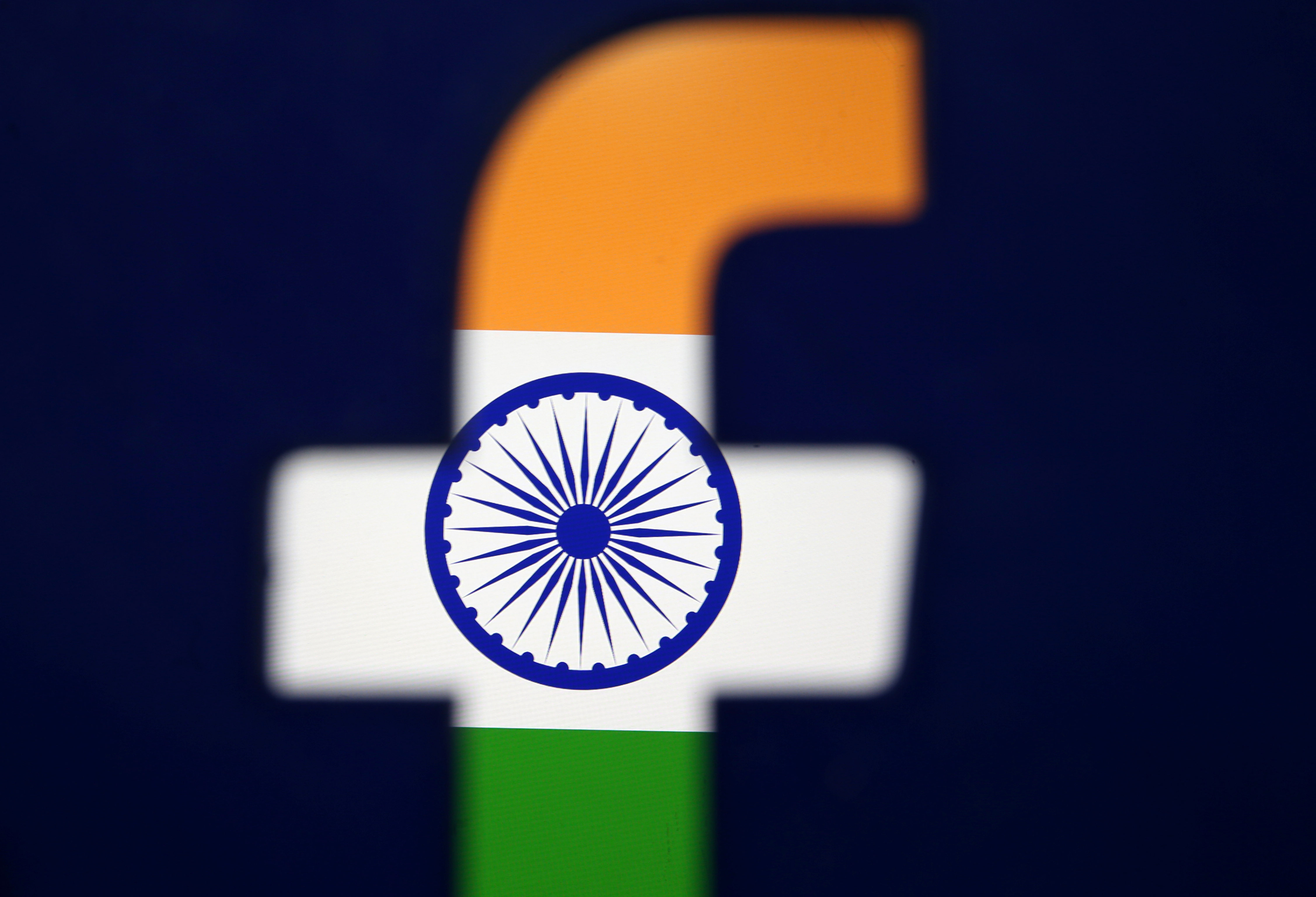 India's flag is seen through a 3D printed Facebook logo