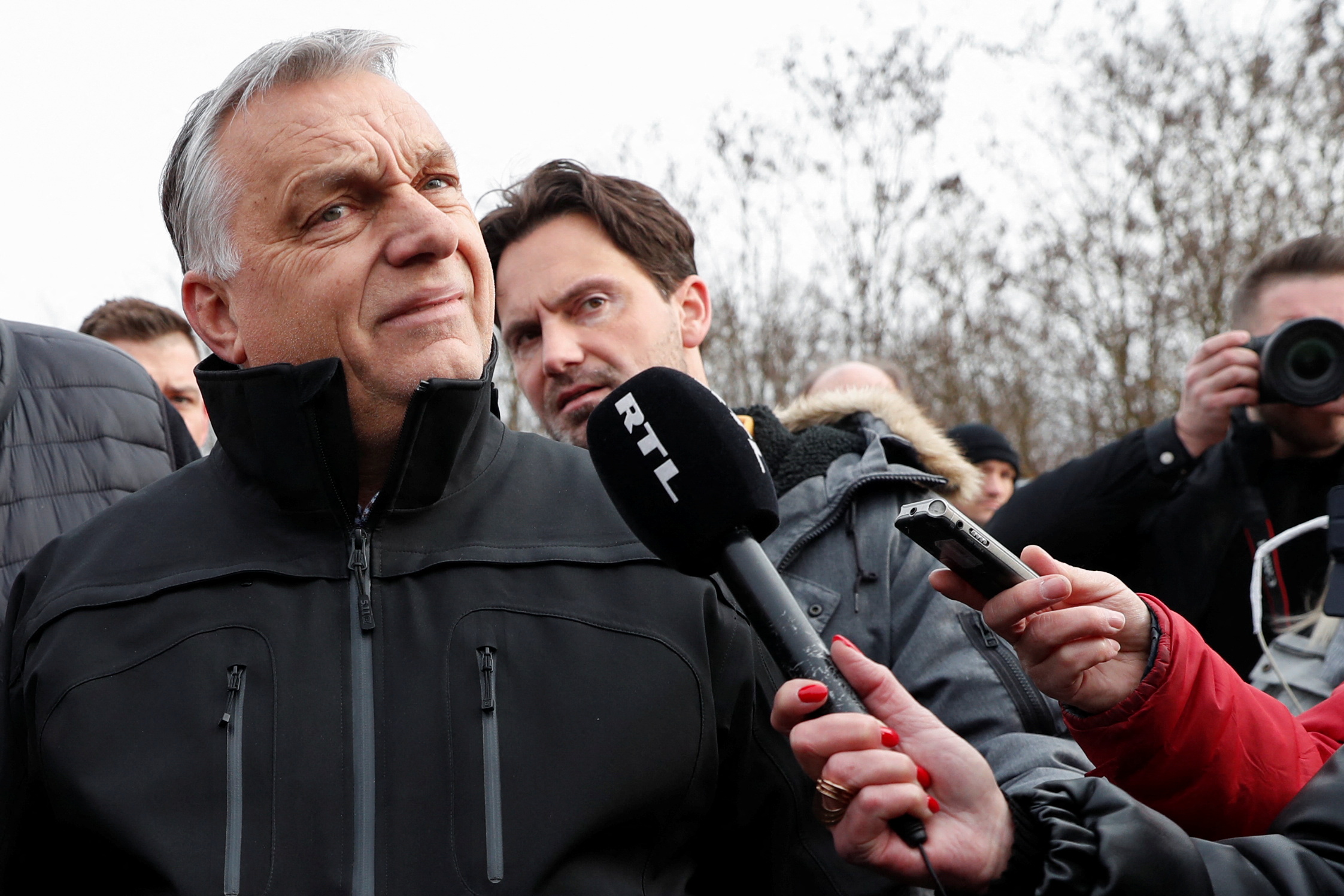 Hungarian Prime Minister Viktor Orban speaks to the media as he visits the Ukraine-Hungary border