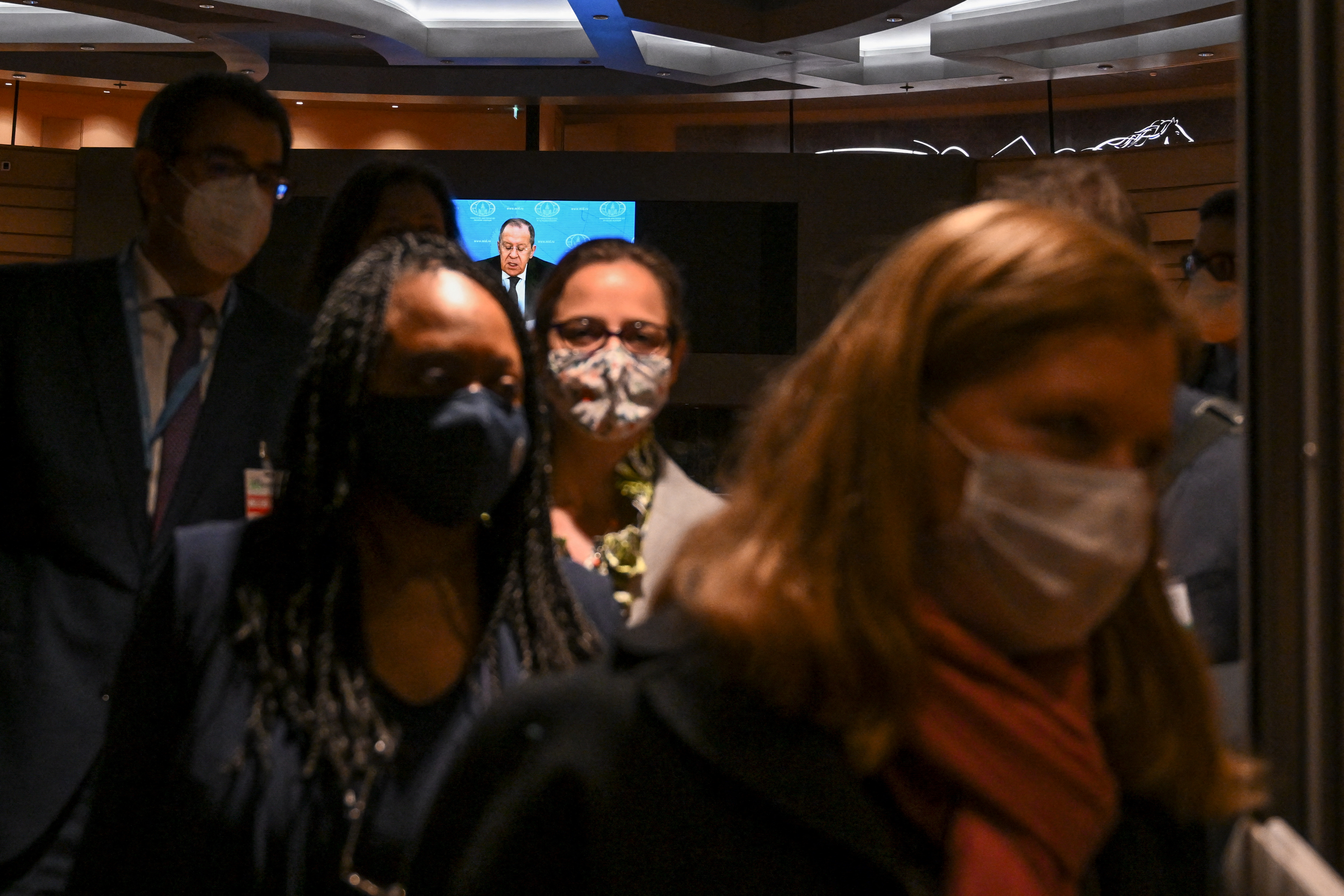 Diplomats are seen walking out in protest against Russia's invasion of Ukraine while Russia's foreign minister Sergey Lavrov addresses the Conference on Disarmament
