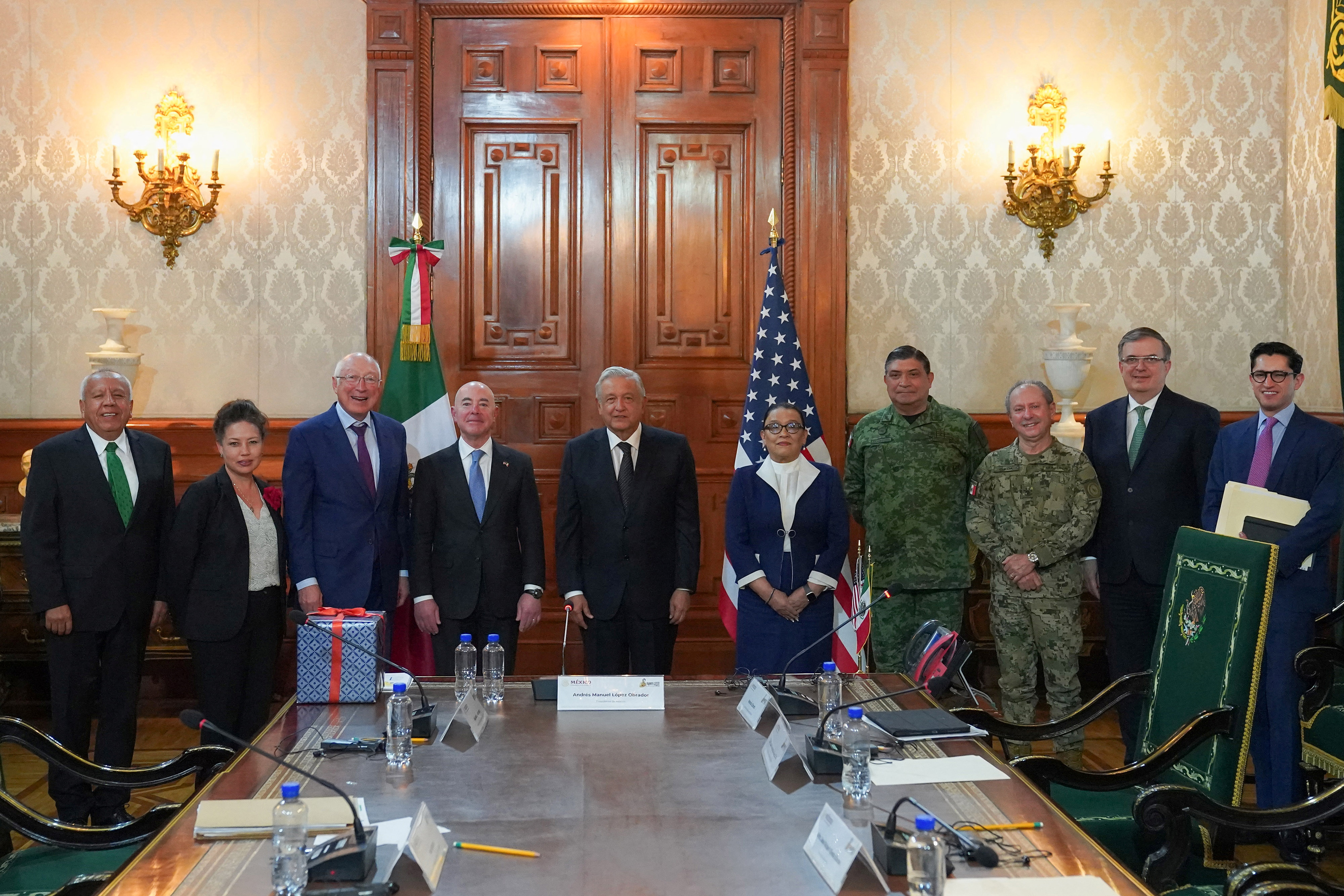 U.S. Homeland Security Secretary Alejandro Mayorkas and Mexican President Andres Manuel Lopez Obrador pose for a photo with delegations from both countries