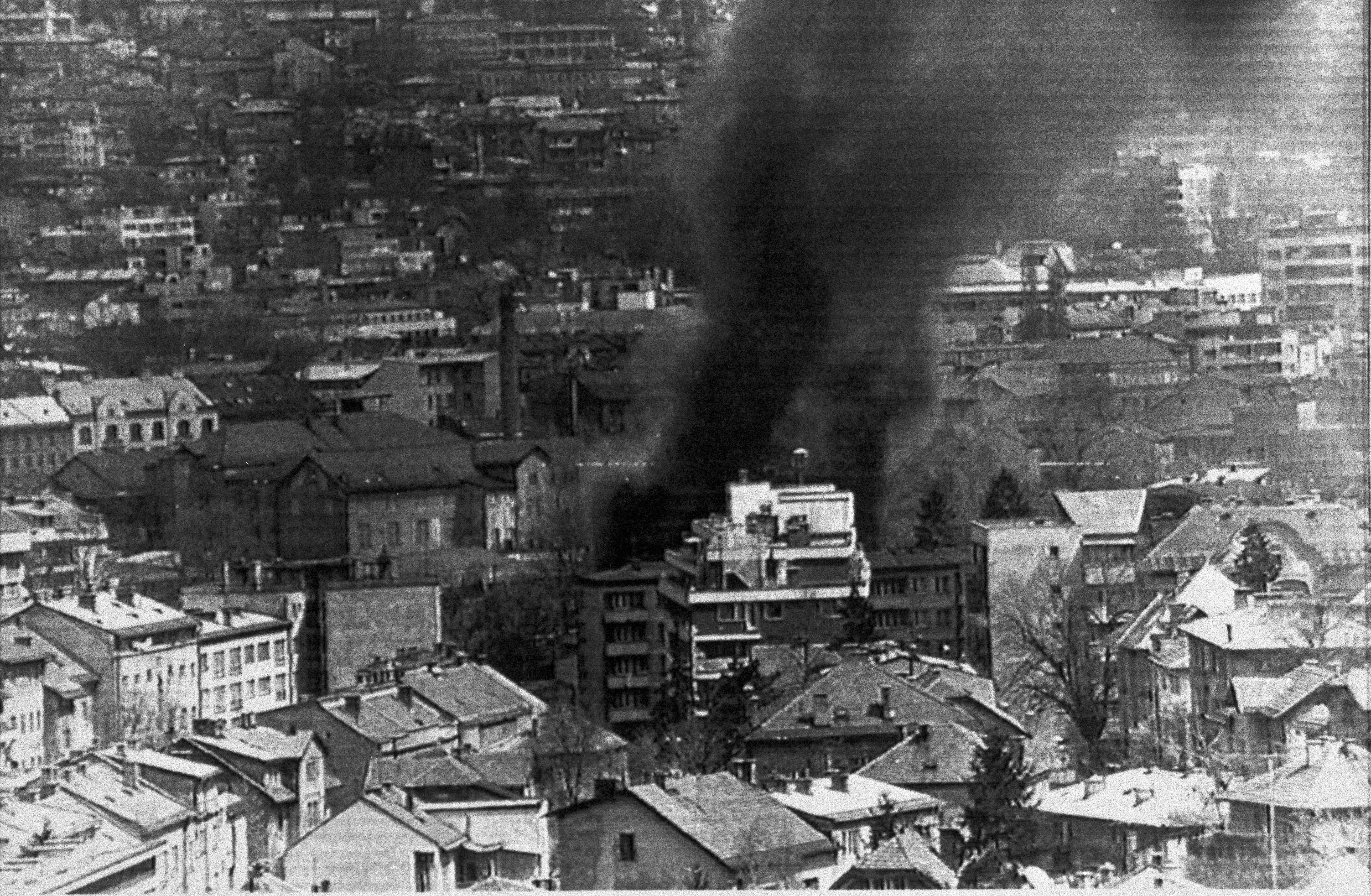 Smoke billows from a burning building in Sarajevo in 1992