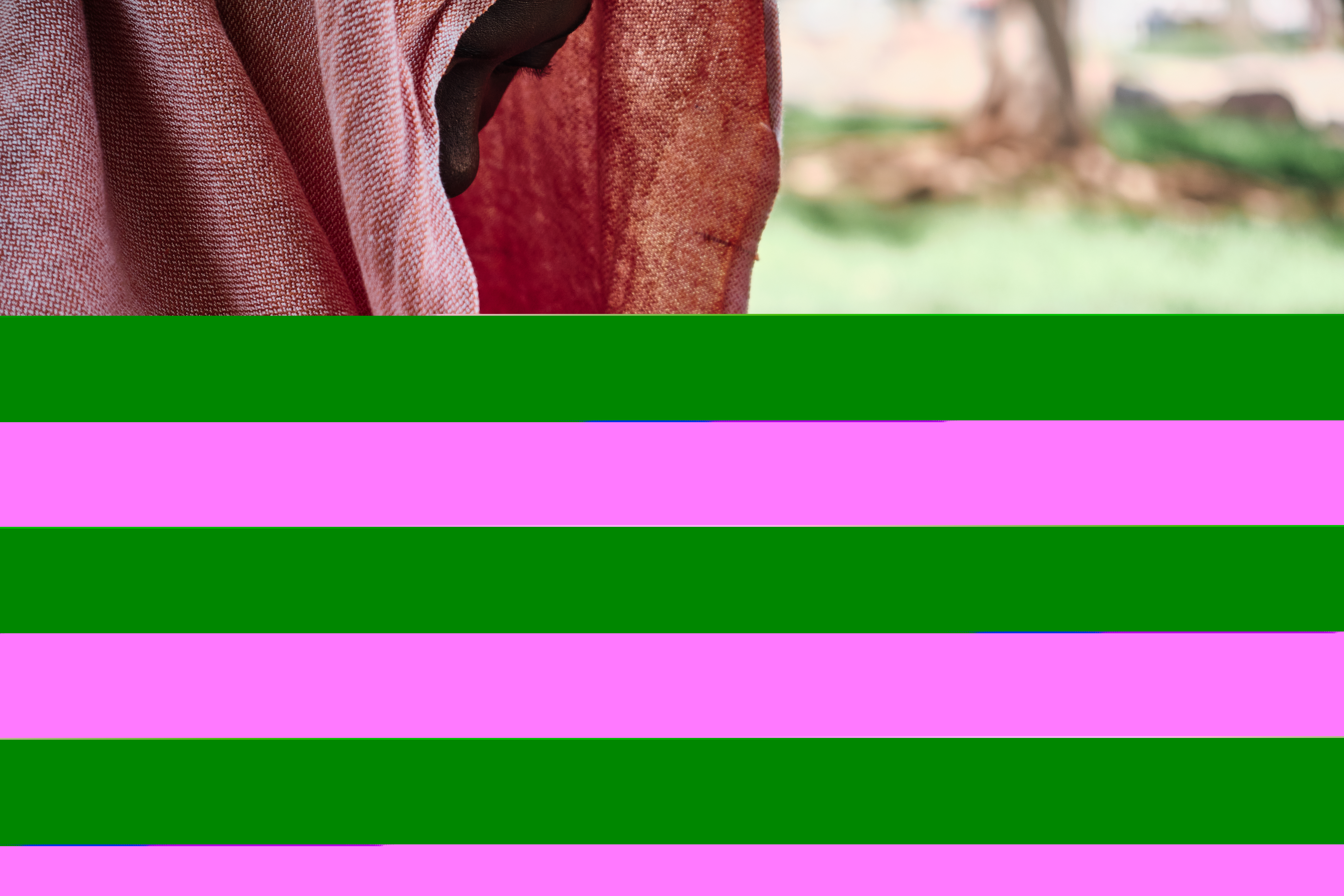 A photo of a woman feeding her baby.