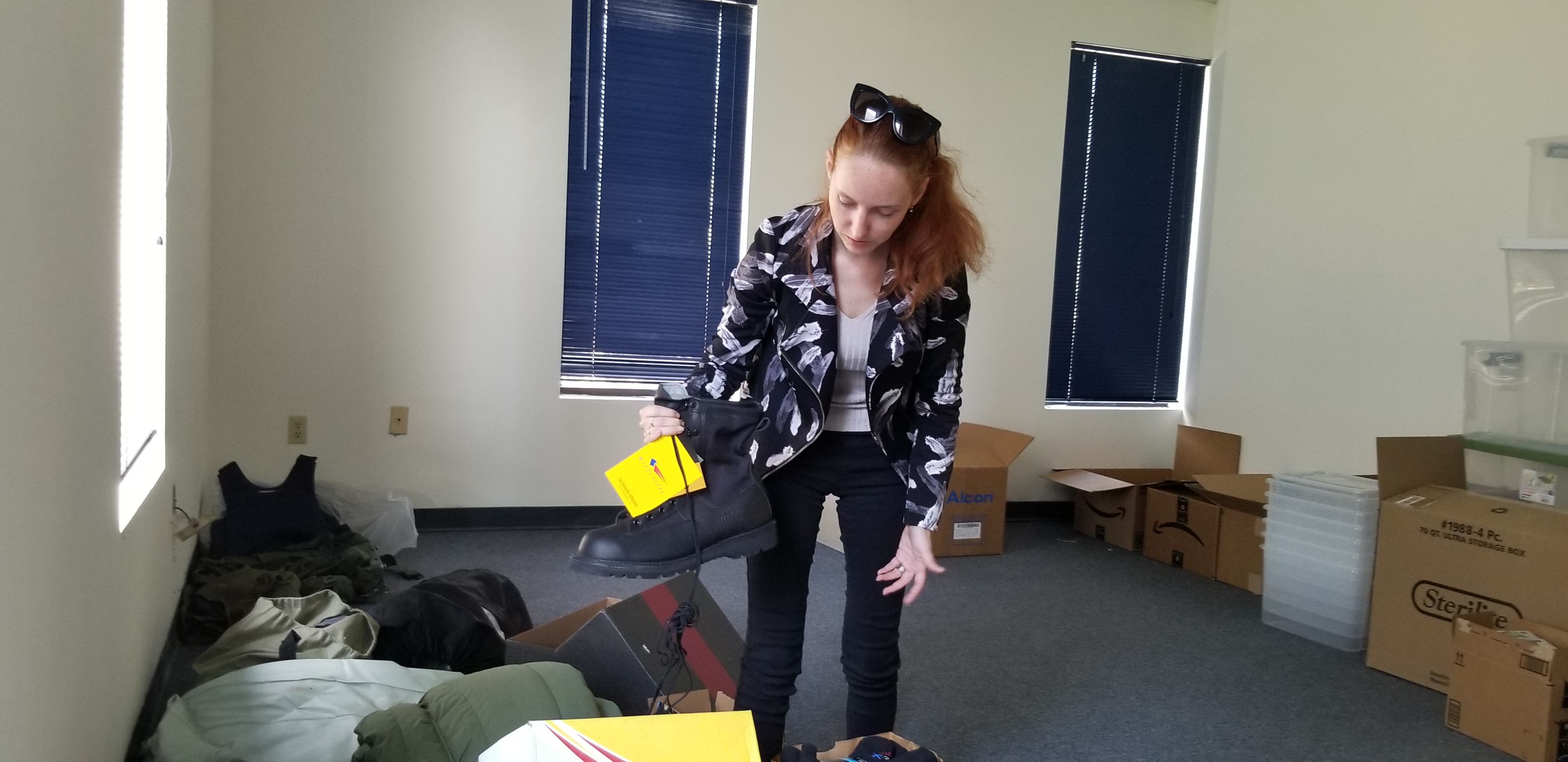 Evgenia Nemirovska De Santos sifts through a pile of donations