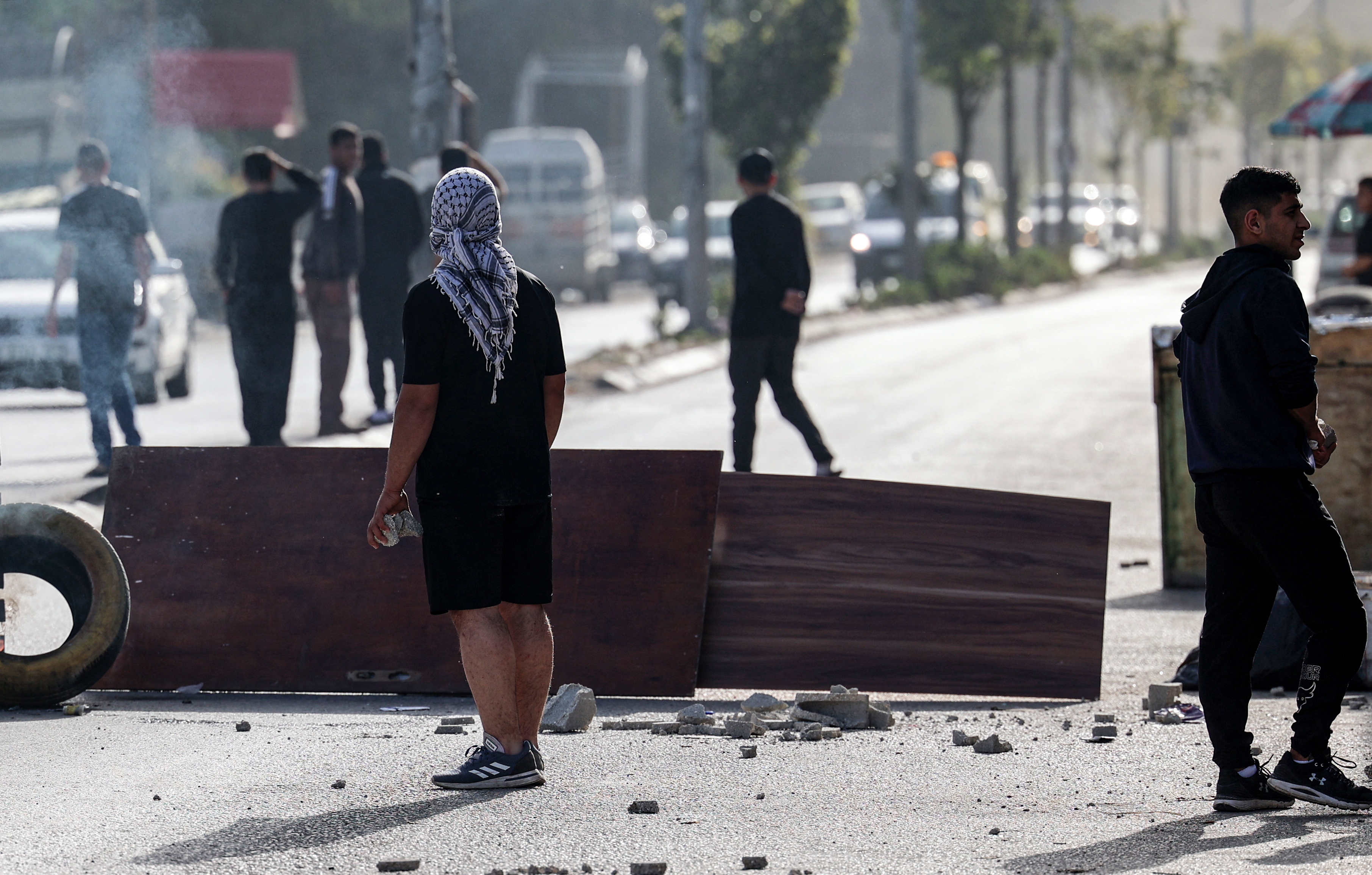 Palestinians confront Israeli troops at the entrance of the Nur Shams refugee camp near the northern West Bank town of Tulkarem