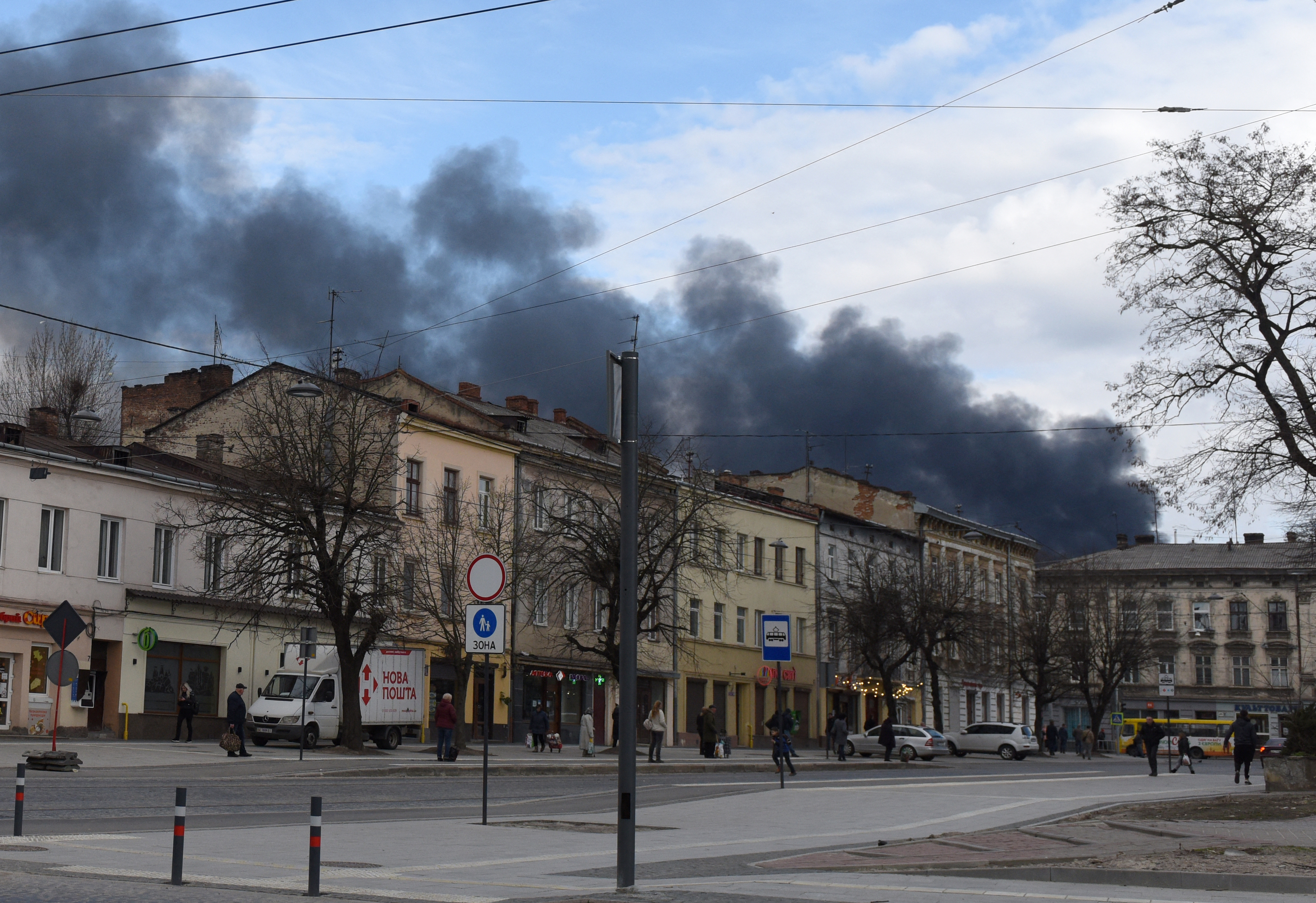 Dark smoke rises following an air strike in the western Ukrainian city of Lviv
