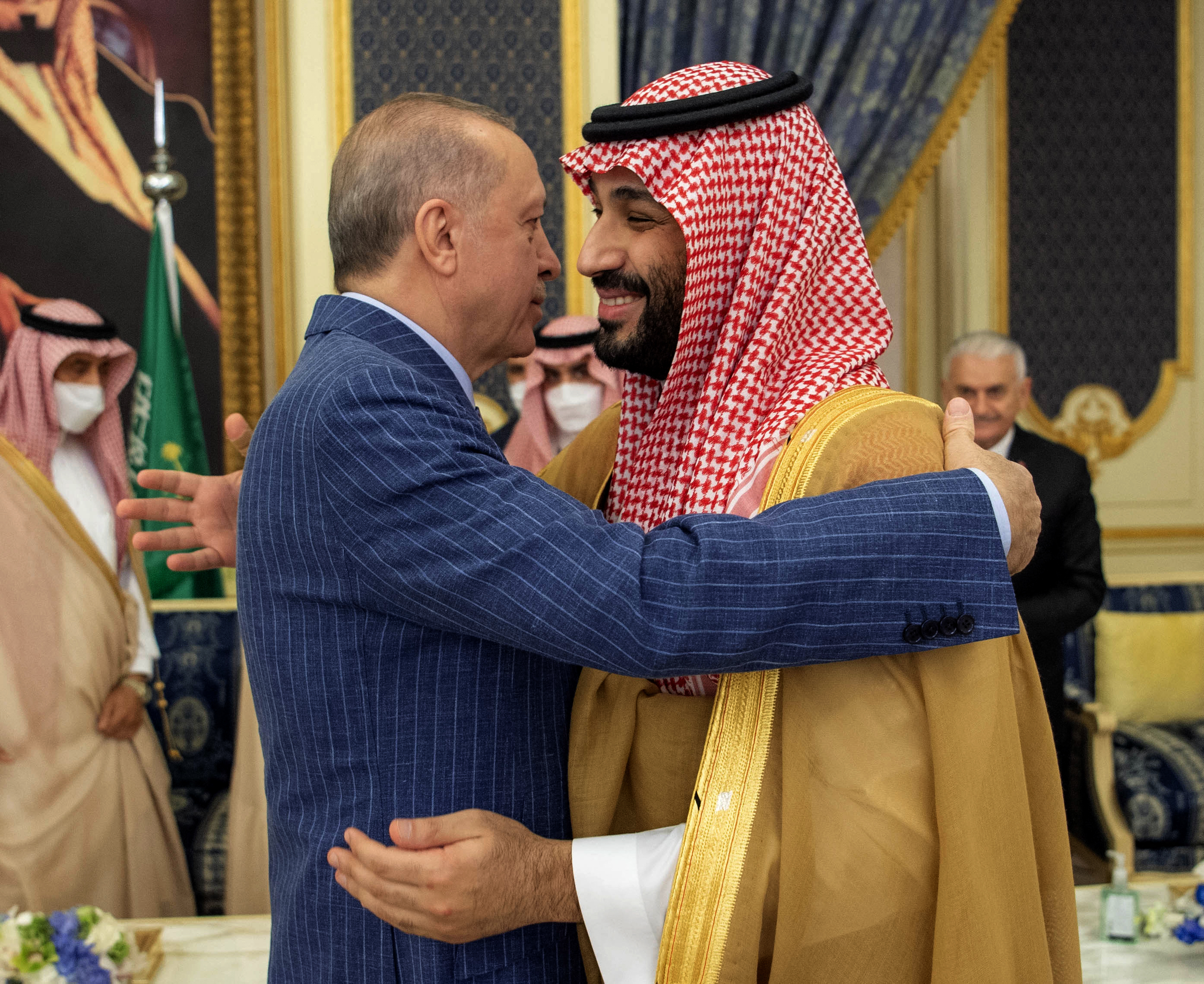 Saudi crown prince and Turkish president embrace